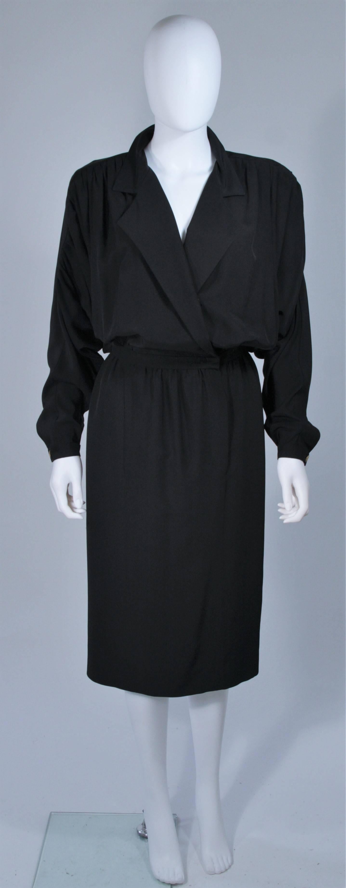  This Chanel dress is composed of a black silk. The draped style features dolman style sleeves and gathers/pleates at the shoulders. There is a center front closure. In excellent vintage condition. 

**Please cross-reference measurements for