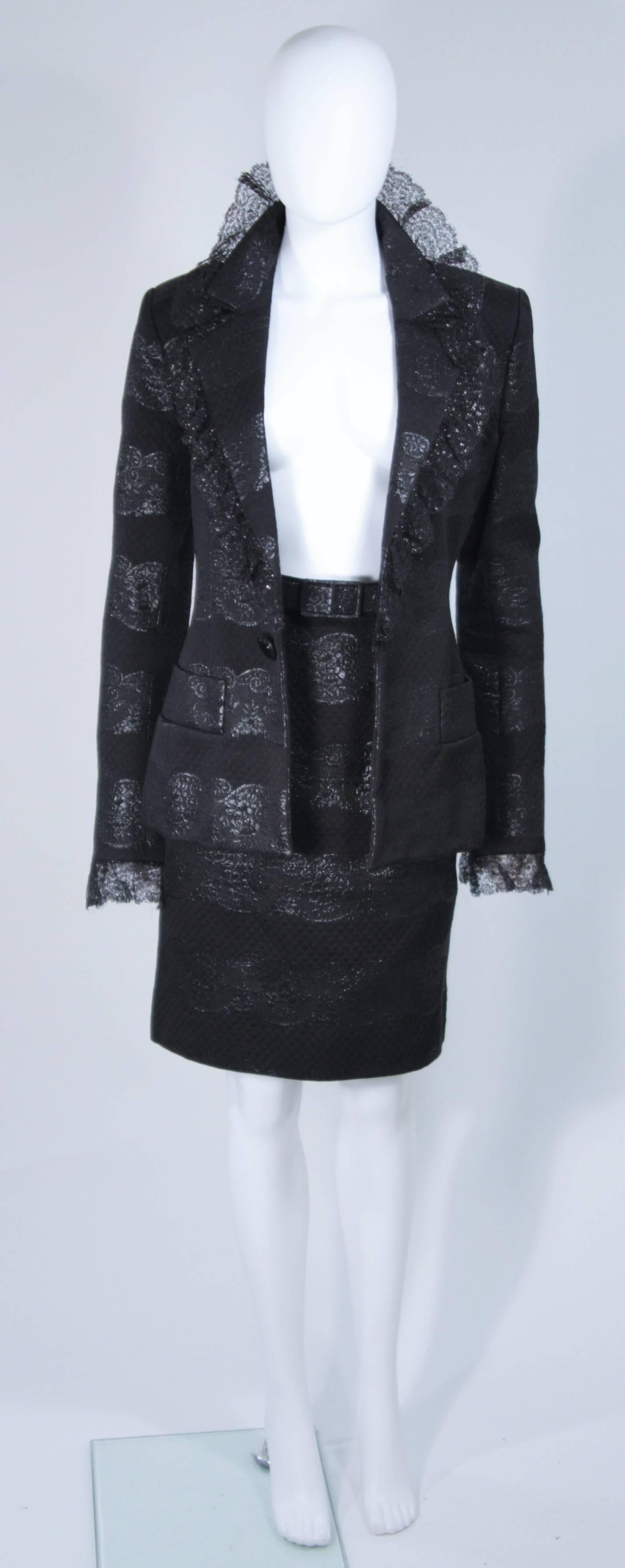  This Jacqueline De Ribes Couture skirt suit is composed of a black textured silk with lame patterning and lace trim. The jacket has an open style with pockets. The pencil style skirt has a zipper closure. In excellent vintage condition. 

