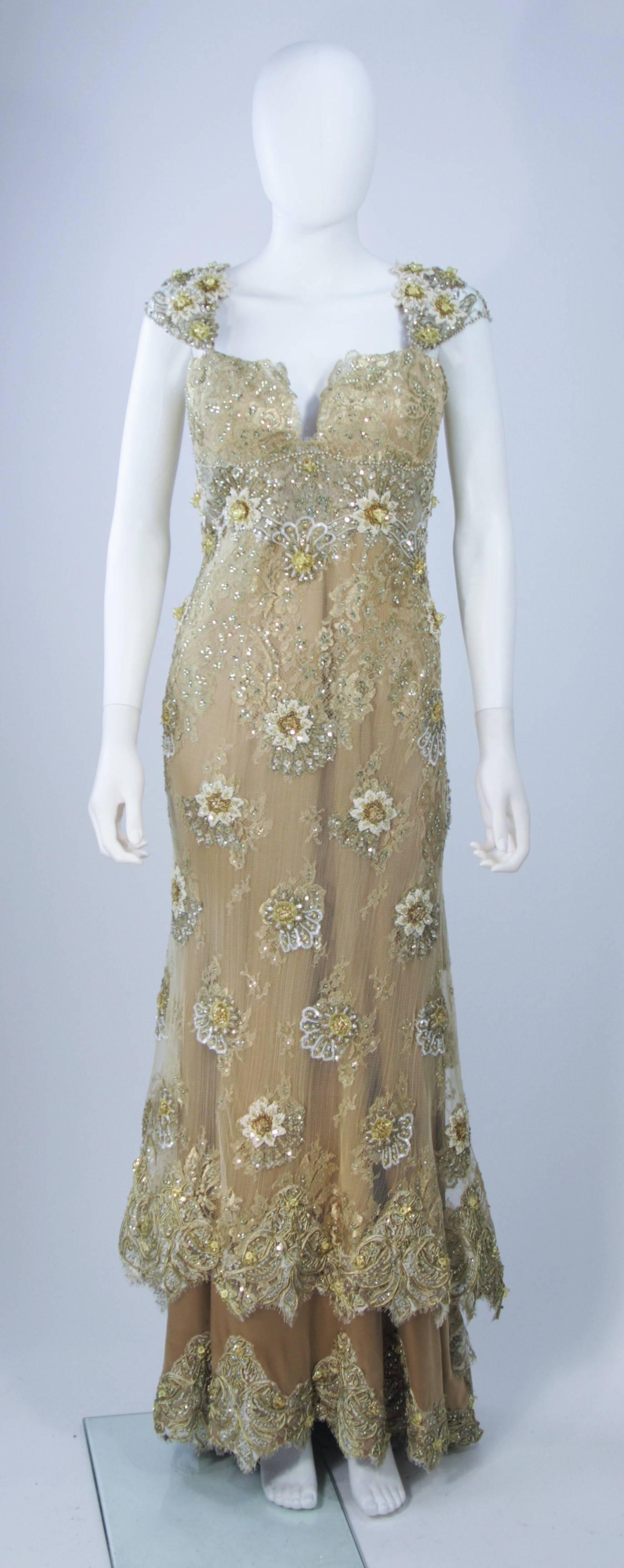  This Barraci gown is composed of a gold and yellow lace/silk combination which is embellished with rhinestones. There is a boned foundation, center back zipper closure, and corset style lace up back. In excellent vintage condition. 

**Please