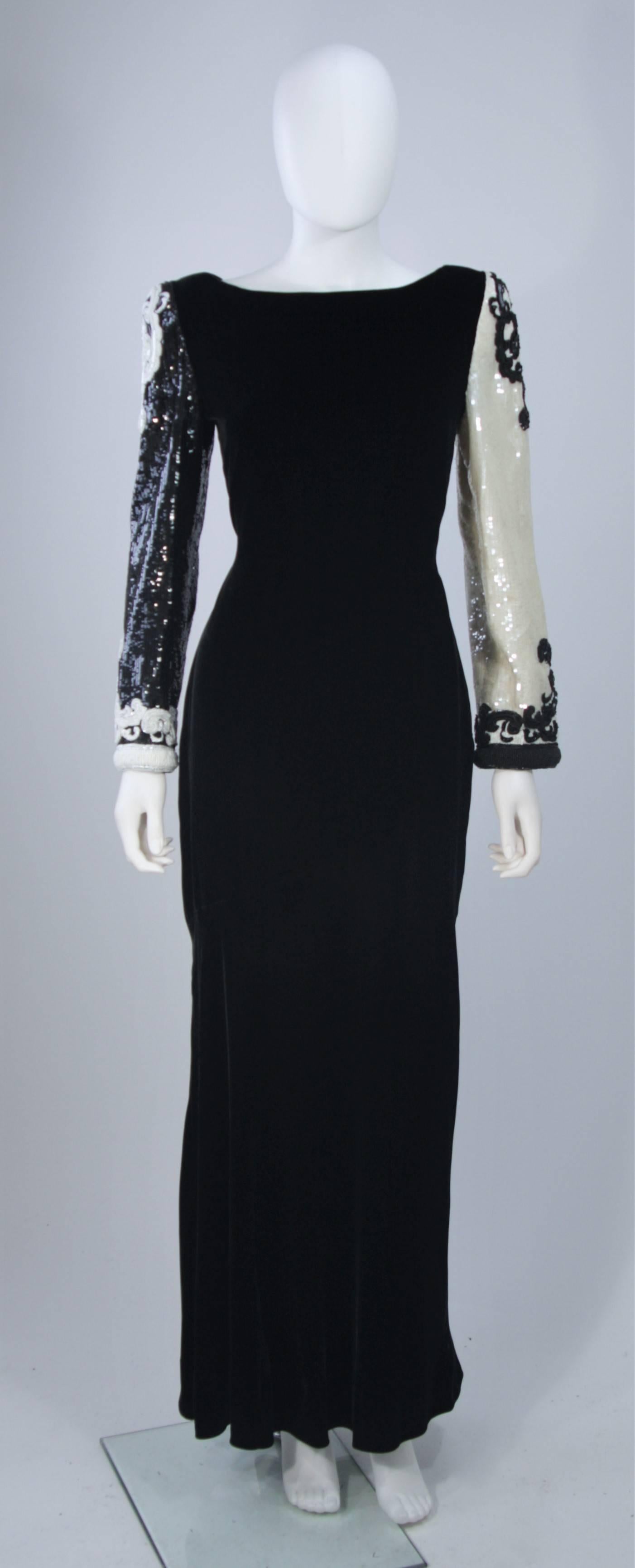  This Bill Blass gown is composed of a black velvet and features sequin sleeves with beading. There is a center back zipper closure, shoulder pads, and boat style neckline. In excellent vintage condition. 

 **Please cross-reference measurements