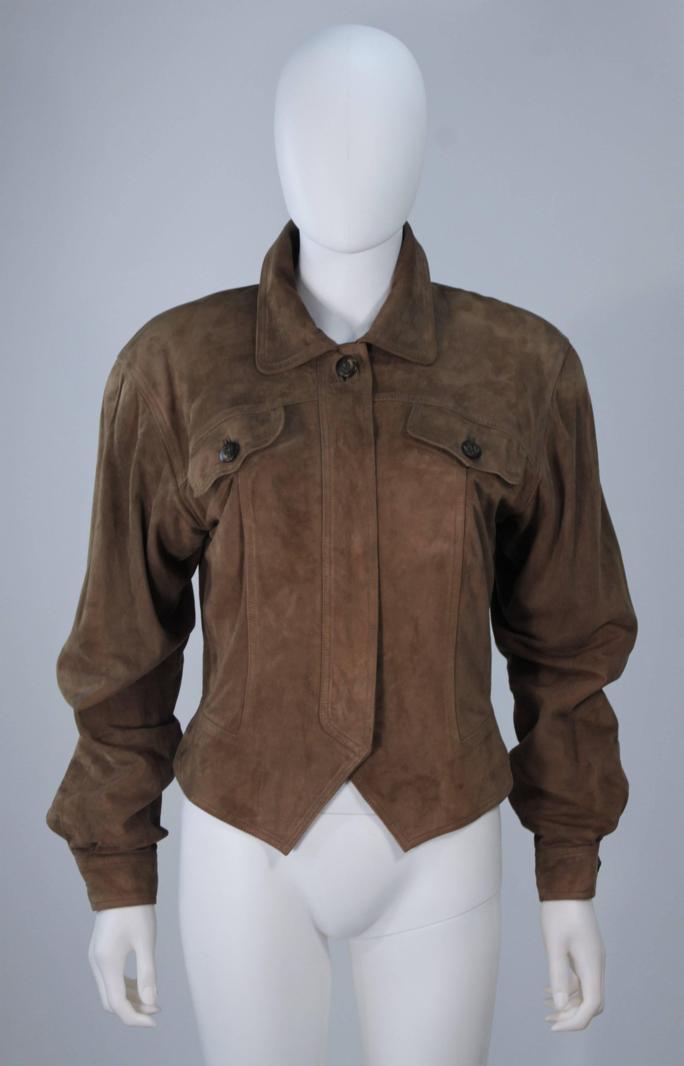  This Gucci jacket is composed of a supple khaki brown hue suede. Features center front button closures, and shoulder pads. In excellent vintage condition.

 **Please cross-reference measurements for personal accuracy. 

Measures