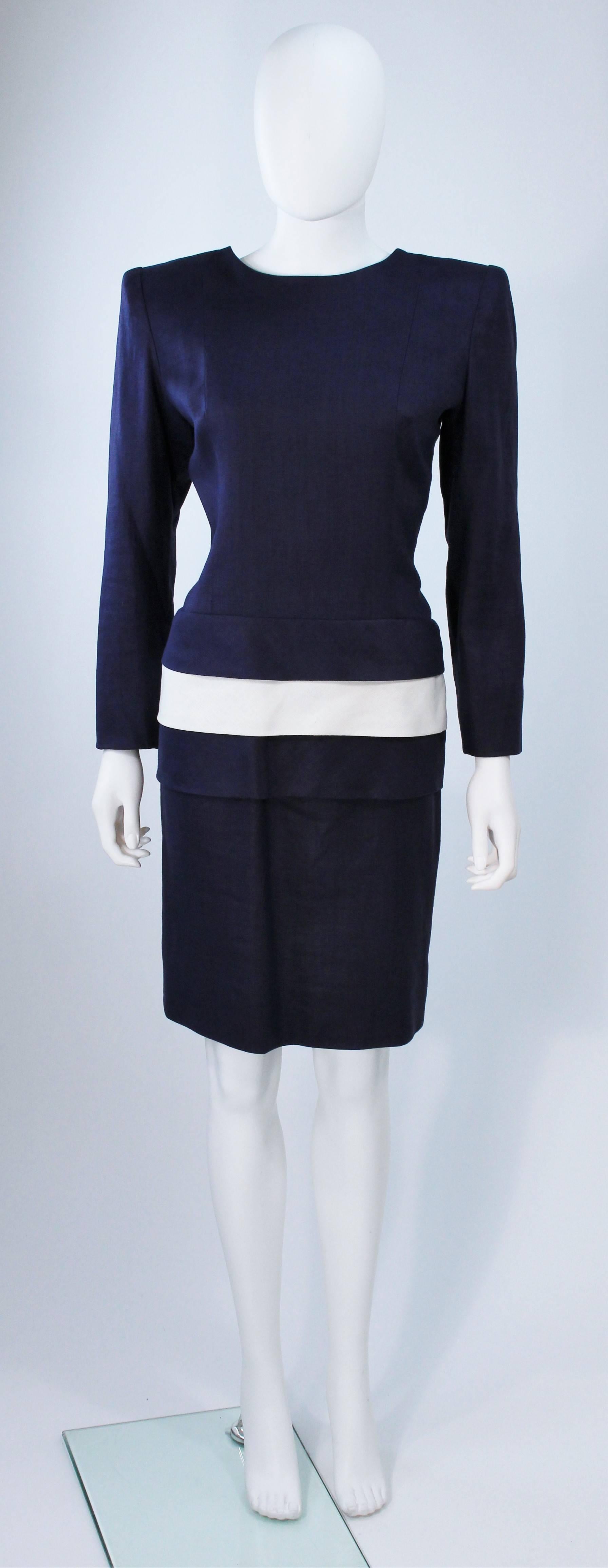  This Givenchy Couture dress is composed of navy and white linen. Features shoulder pads, a center back bow, and center back closures. In excellent vintage condition. 

**Please cross-reference measurements for personal accuracy. Size in