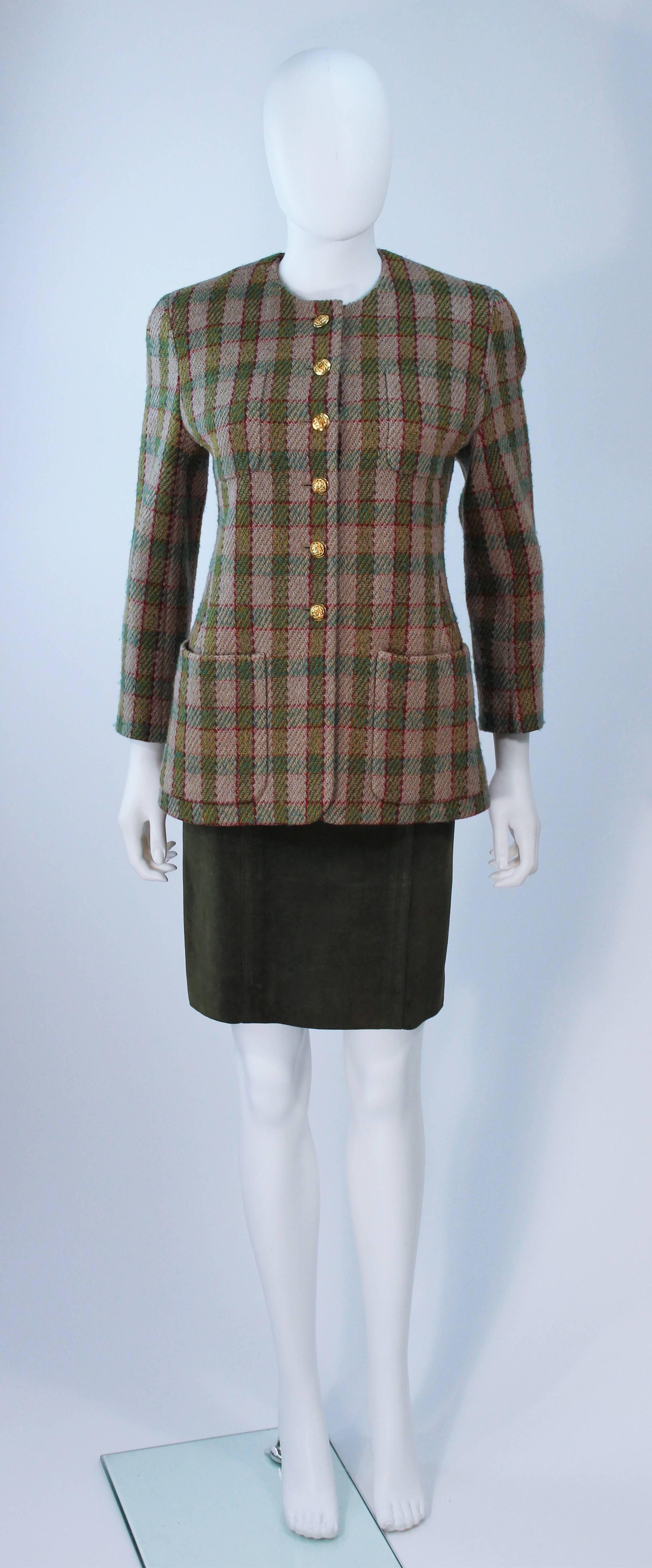  This Chanel skirt suit is composed of wool in khaki, burgundy, and green with an olive suede skirt. The jacket is has center front gold logo button closures. The pencil style skirt features a zipper closure with hook and eye. In excellent vintage