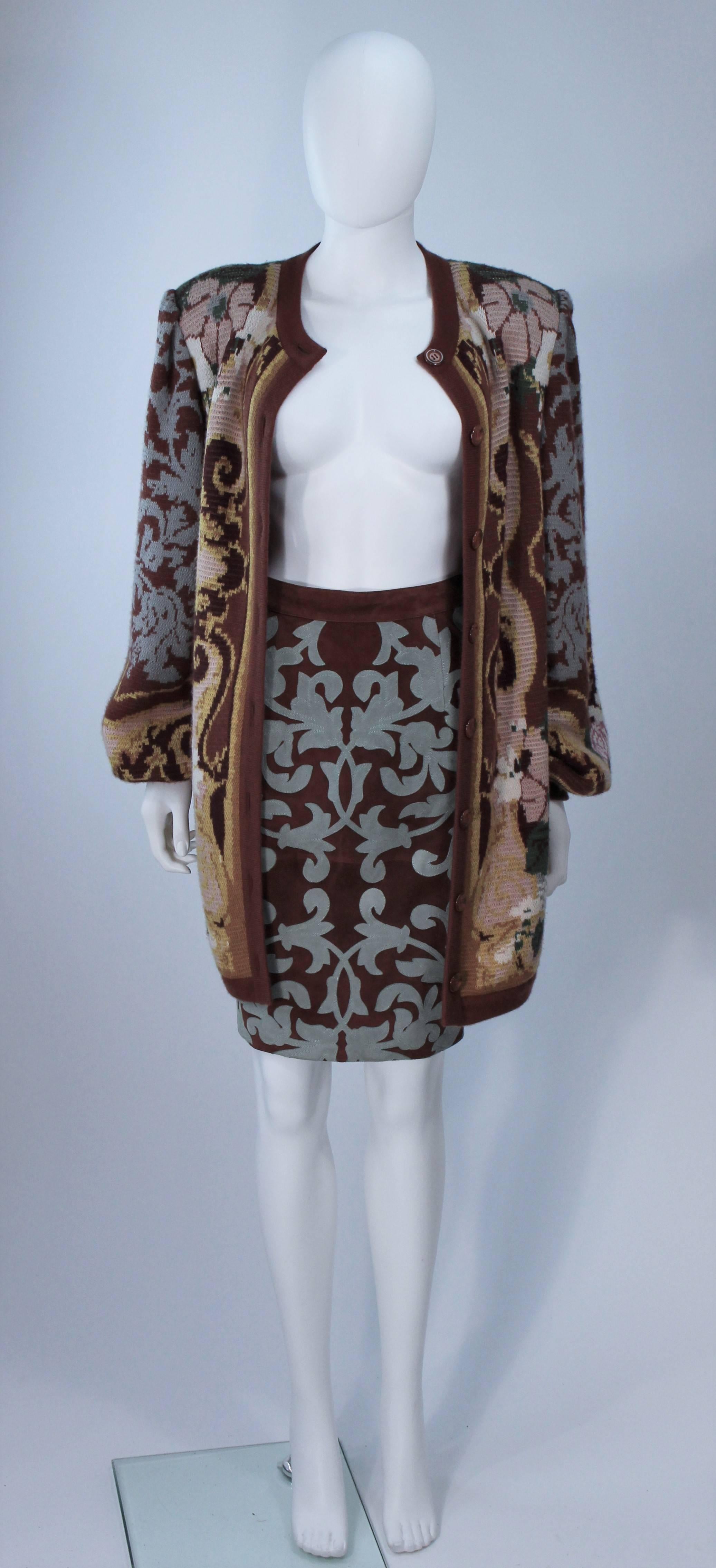  This Valentino ensemble is composed of a cashmere blend sweater and a suede skirt with a patterned applique. The sweater has center front button closures. The skirt has a side zipper closure. In excellent vintage condition. 

**Please