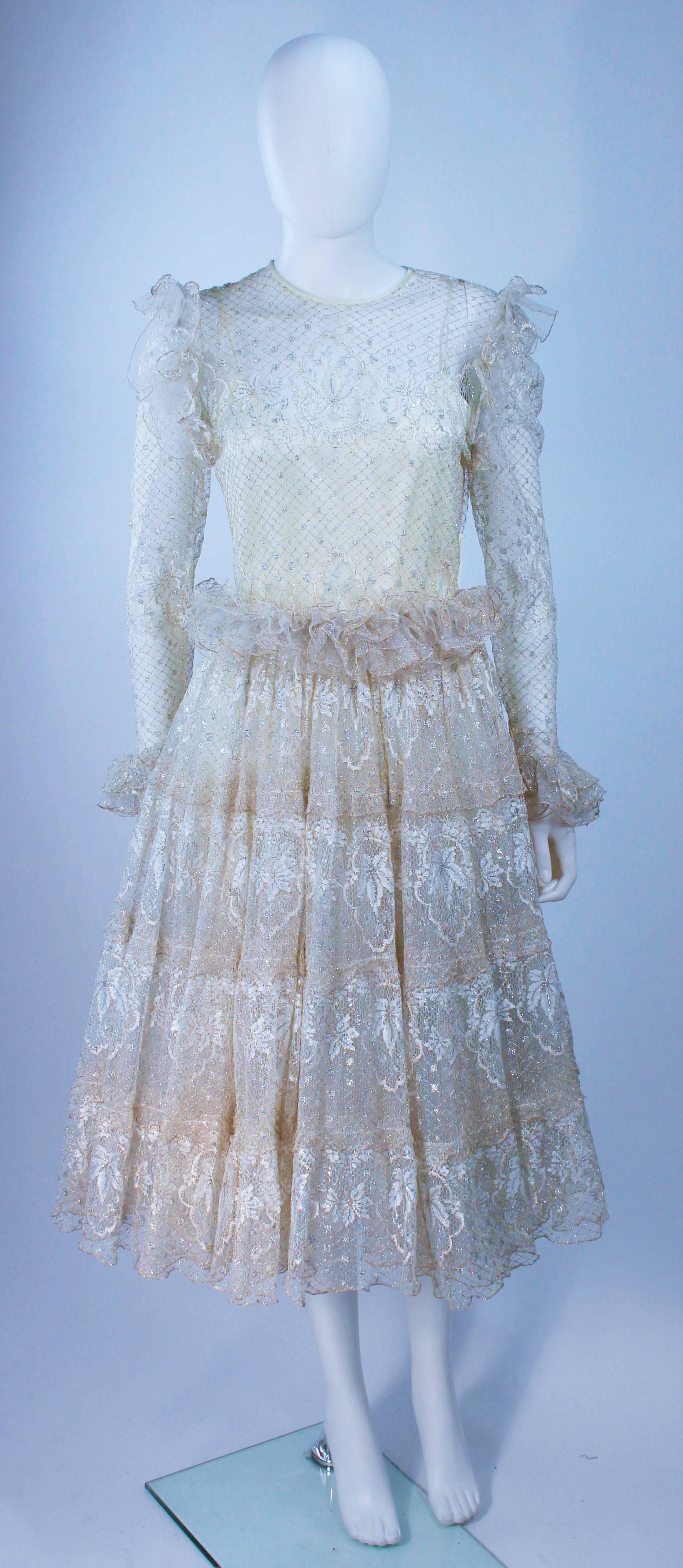  This Ted Lapidus dress is composed of a white and gold lace lame. Features a side button closure and slip with belt. In excellent vintage condition. 

**Please cross-reference measurements for personal accuracy. Size in description box is an