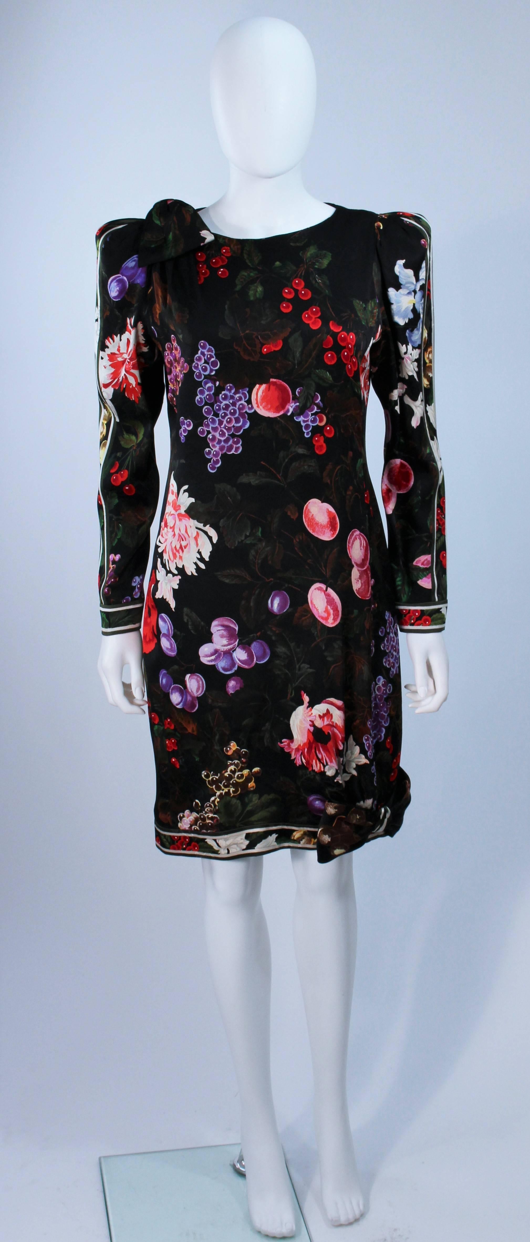  This Leonard  dress is composed of a black printed silk and features bow accents. There is a center back zipper closure. In excellent vintage condition. 

  **Please cross-reference measurements for personal accuracy. Size in description box is