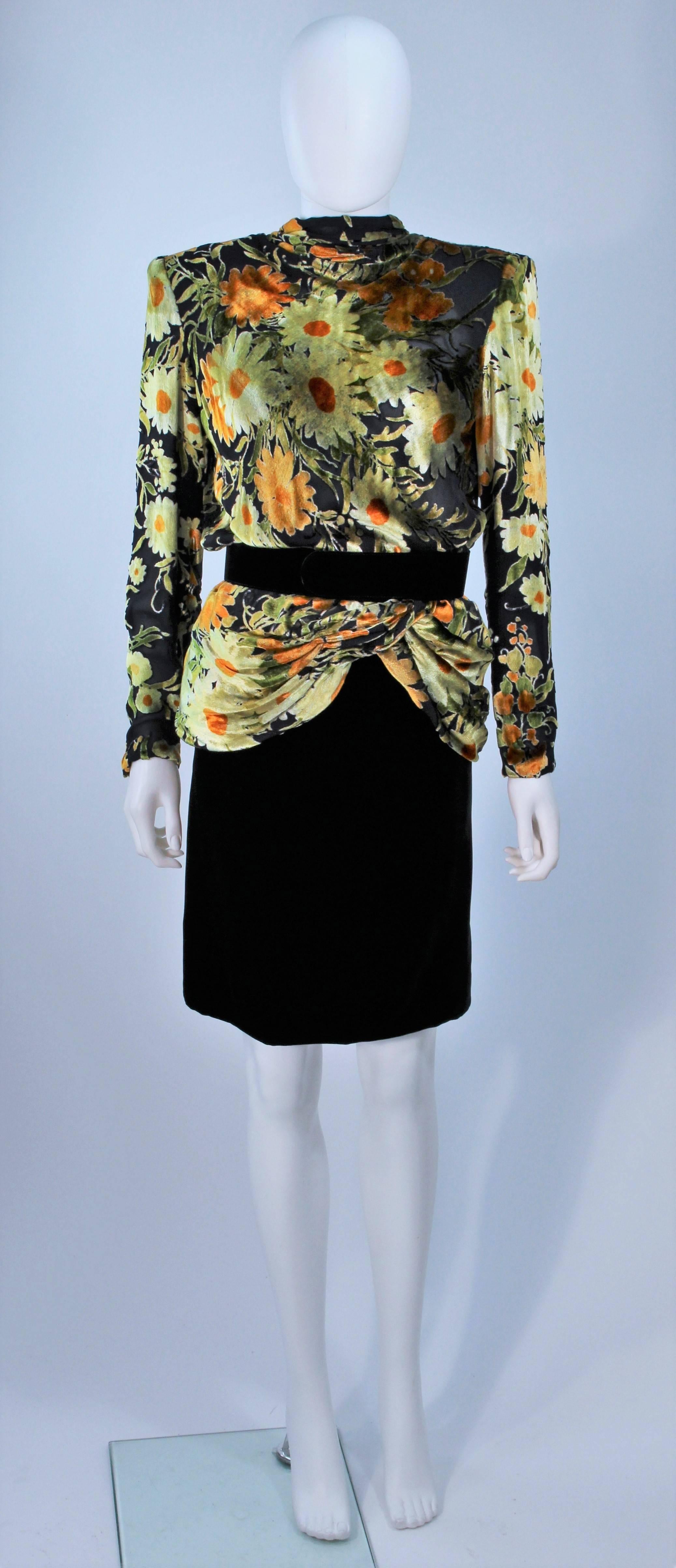  This Valentino set is composed of a silk and velvet combination with black, green, yellow, and orange hues. The draped style top features front closures. The classic pencil silhouette has a zipper closure. In excellent vintage condition. 

 