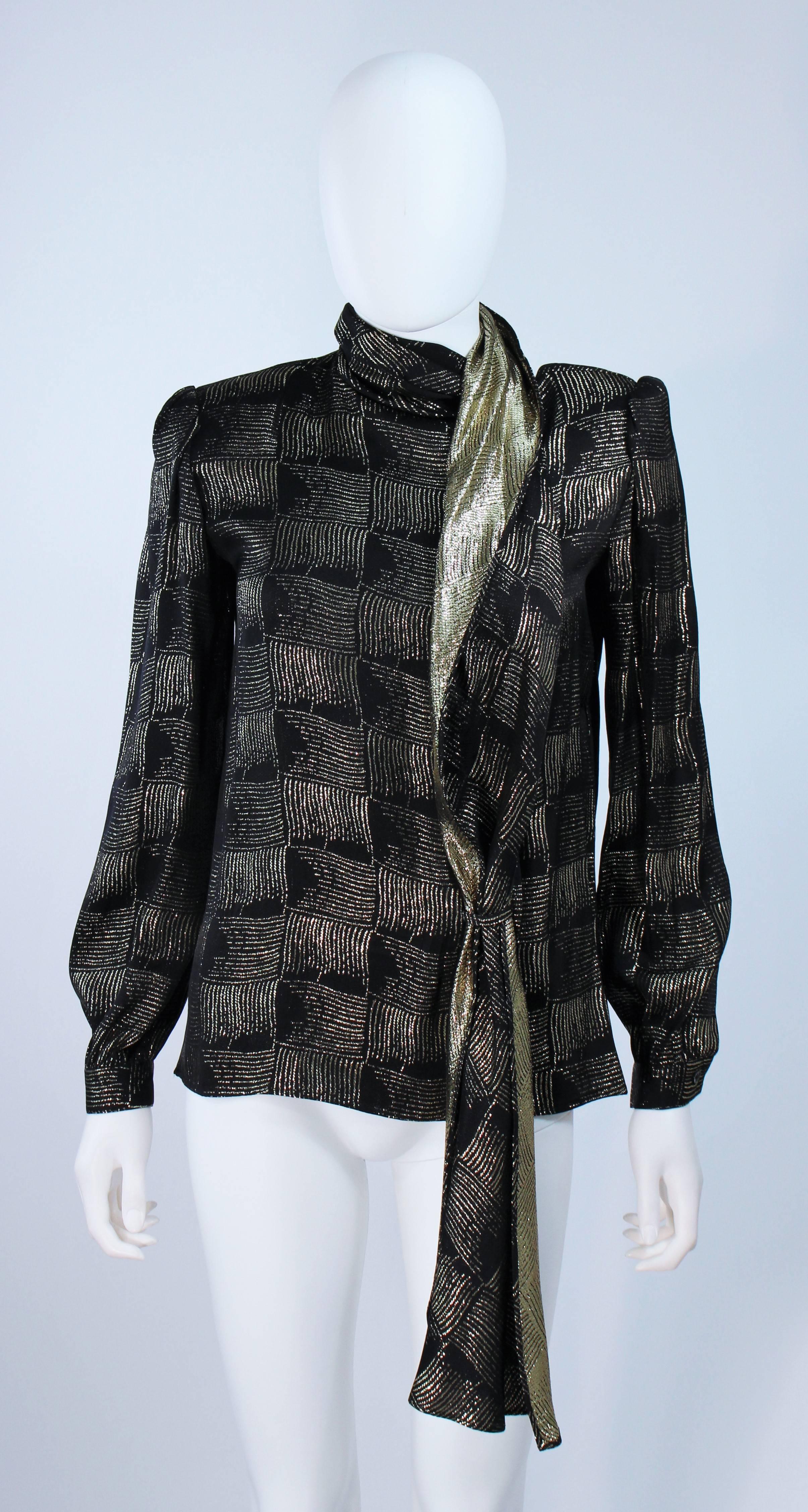  This Valentino blouse is composed of a black and gold silk lame. Features center front buttons and neck sash. In excellent vintage condition. 

**Please cross-reference measurements for personal accuracy. 

Measures (Approximately)
Length: