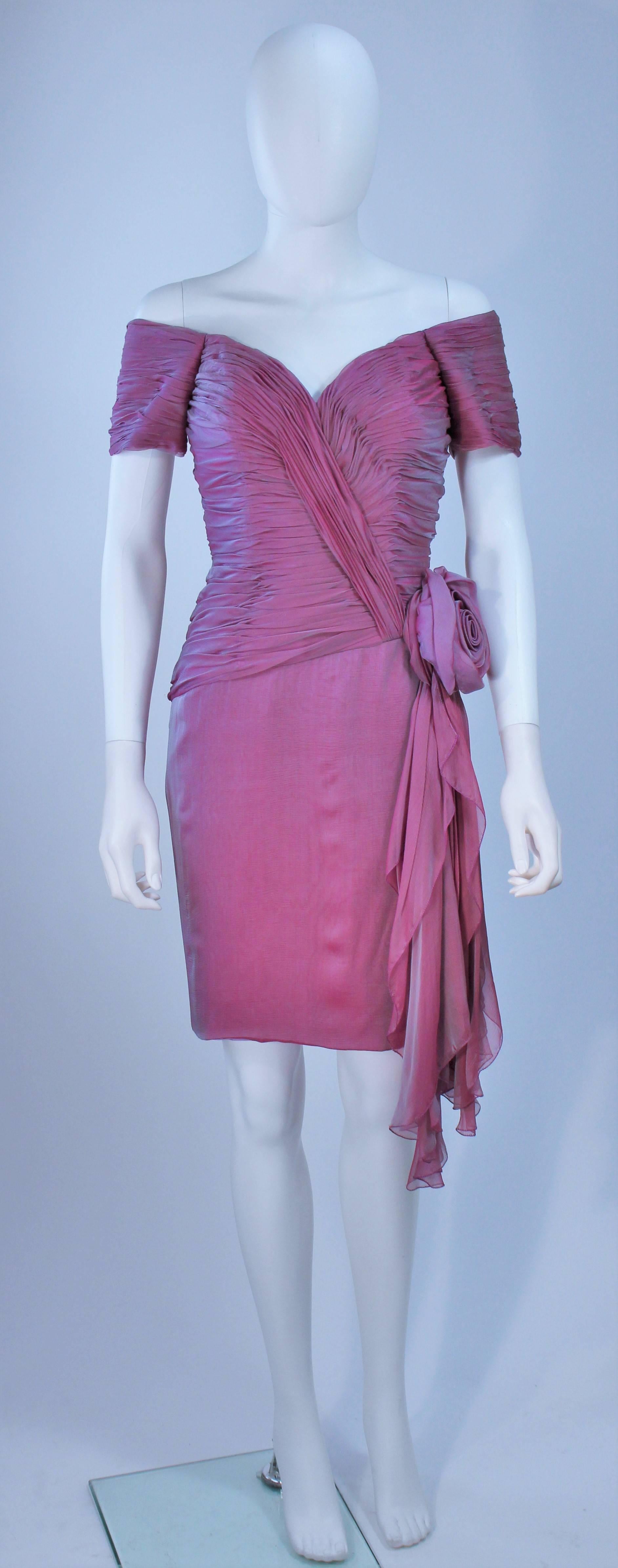  This Vicky Tiel  dress is composed of an iridescent lavender hue silk. Features a large rose and draping with a ruched bodice. There is a center back zipper closure. In excellent vintage condition. 

  **Please cross-reference measurements for