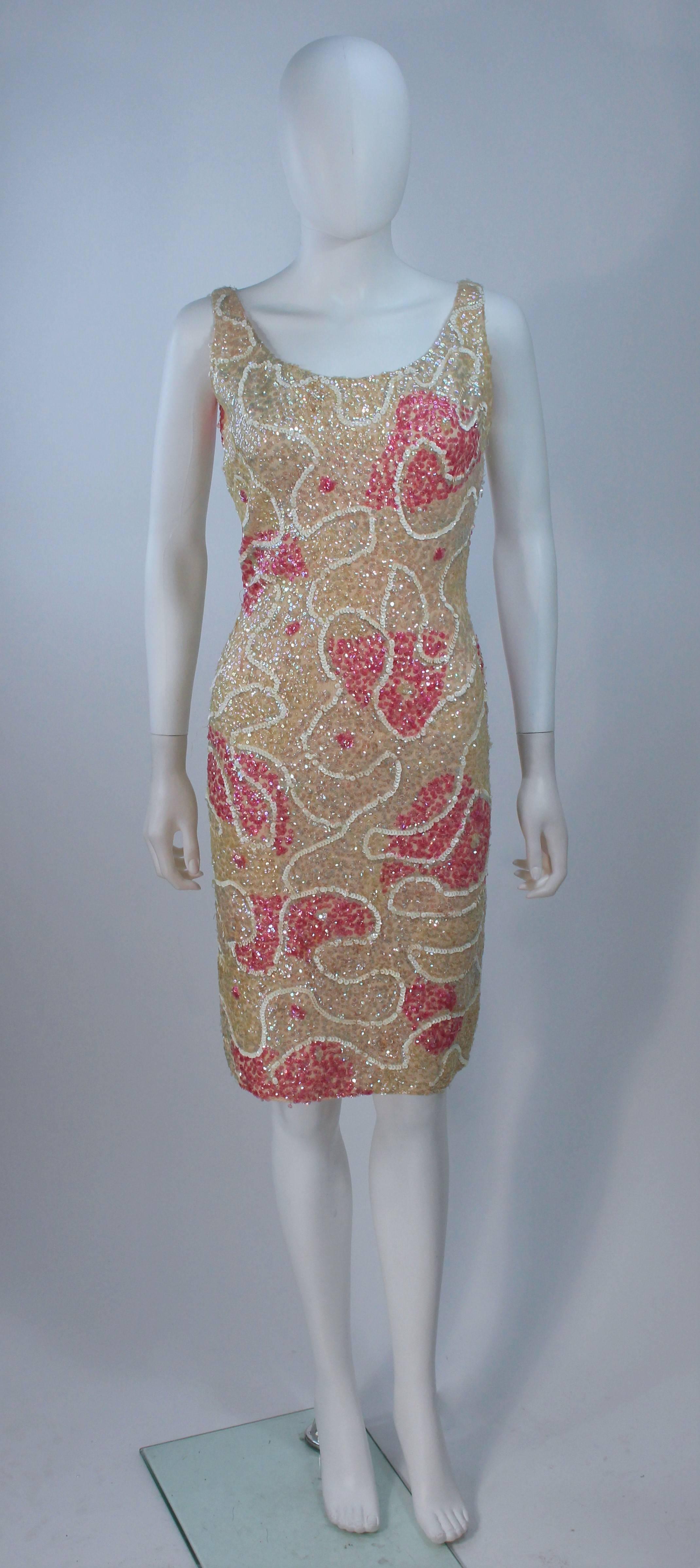  This Gene Shelly's cocktail dress is composed of a stretch knit wool with pink and iridescent sequin applique. There is a center back zipper closure. In great vintage condition. 

**Please cross-reference measurements for personal accuracy. Size