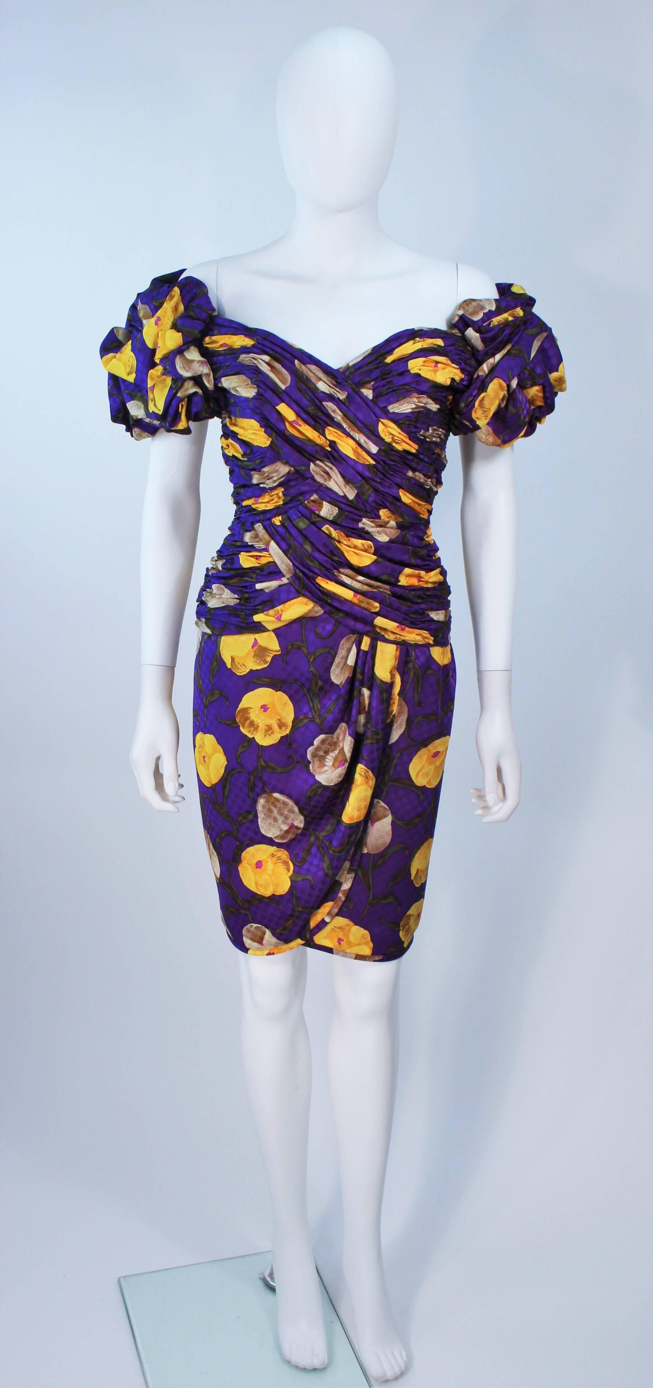  This Lian Carlo cocktail dress is composed of a purple silk with yellow accents in a floral print. Features a ruched bodice. There are ruffled sleeves and a center back zipper. In excellent vintage condition. 

**Please cross-reference