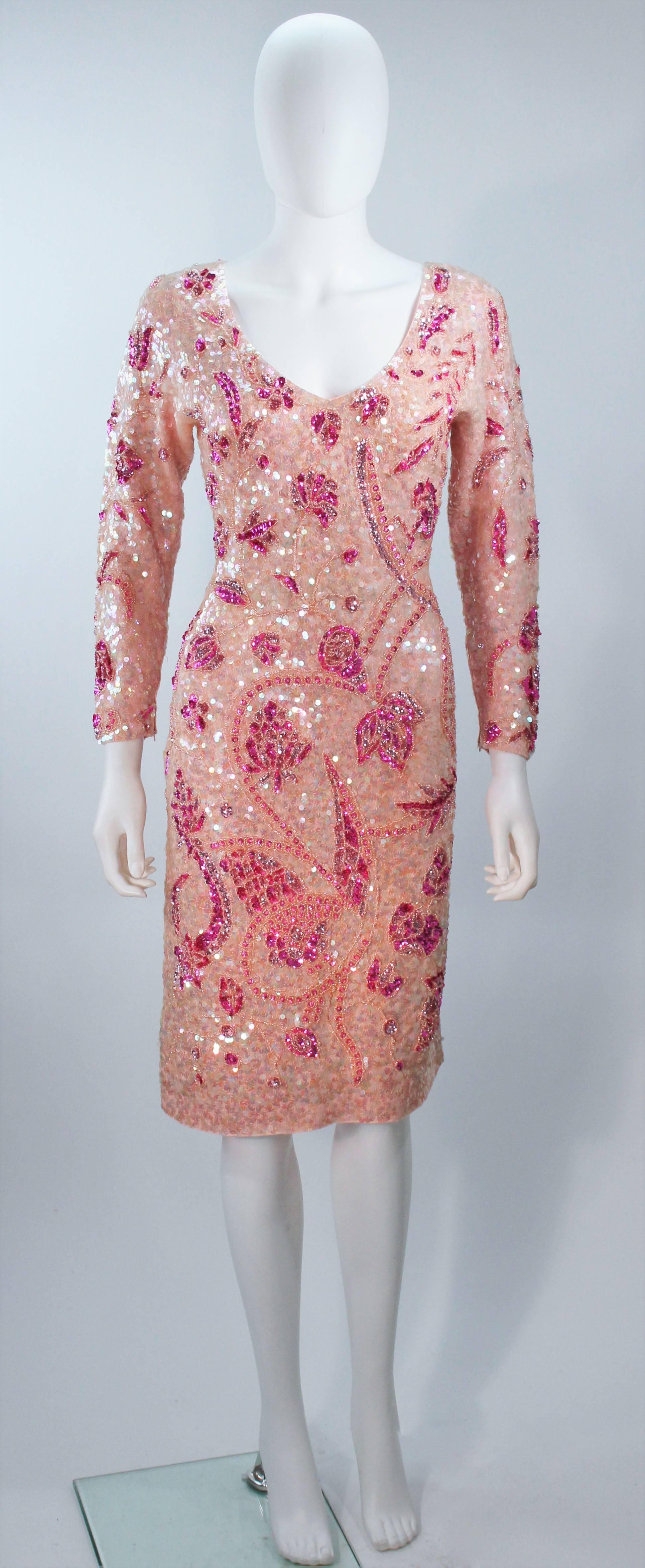  This Gene Shelly dress is composed of a pink stretch knit wool with pink and magenta sequin applique. There is a center back zipper closure. In excellent vintage condition. 

  **Please cross-reference measurements for personal accuracy. Size in