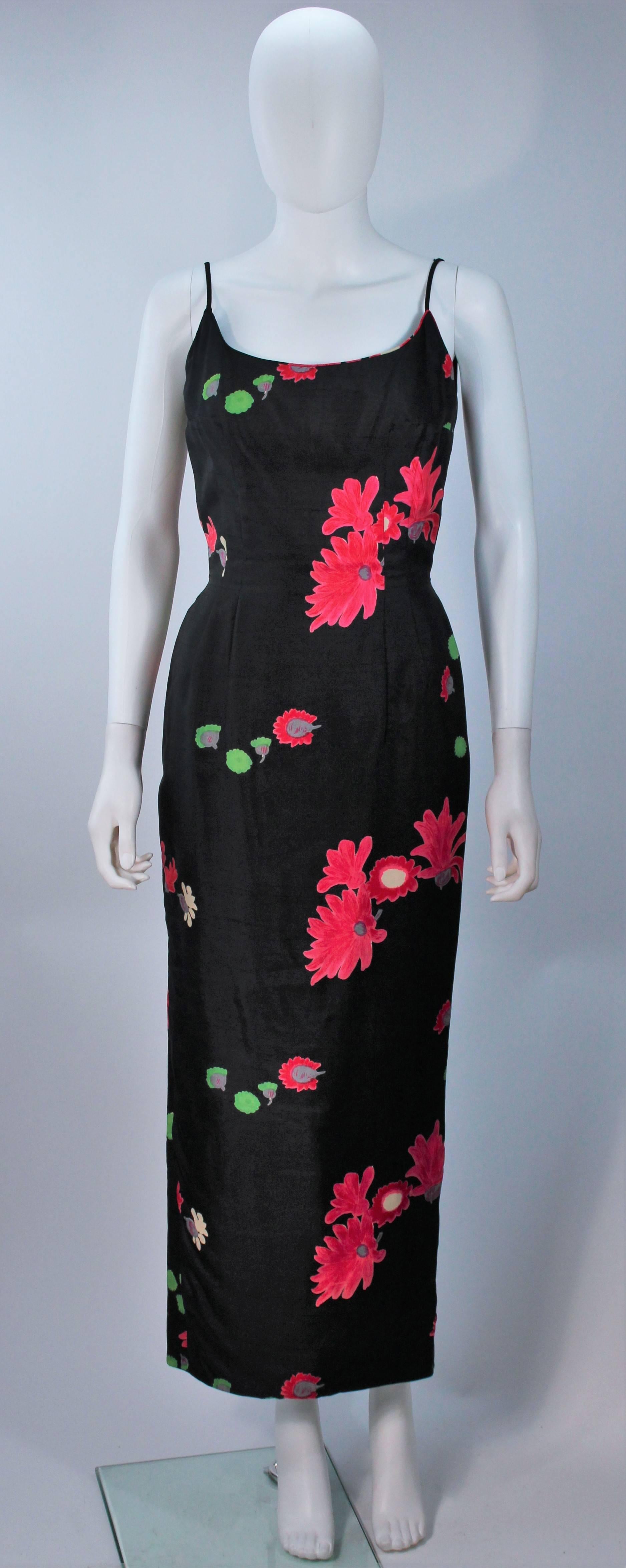  This dress is composed of a floral printed silk. There is a center back zipper closure and bow detail, with pleated hem. In excellent vintage condition. 

  **Please cross-reference measurements for personal accuracy. Size in description box is
