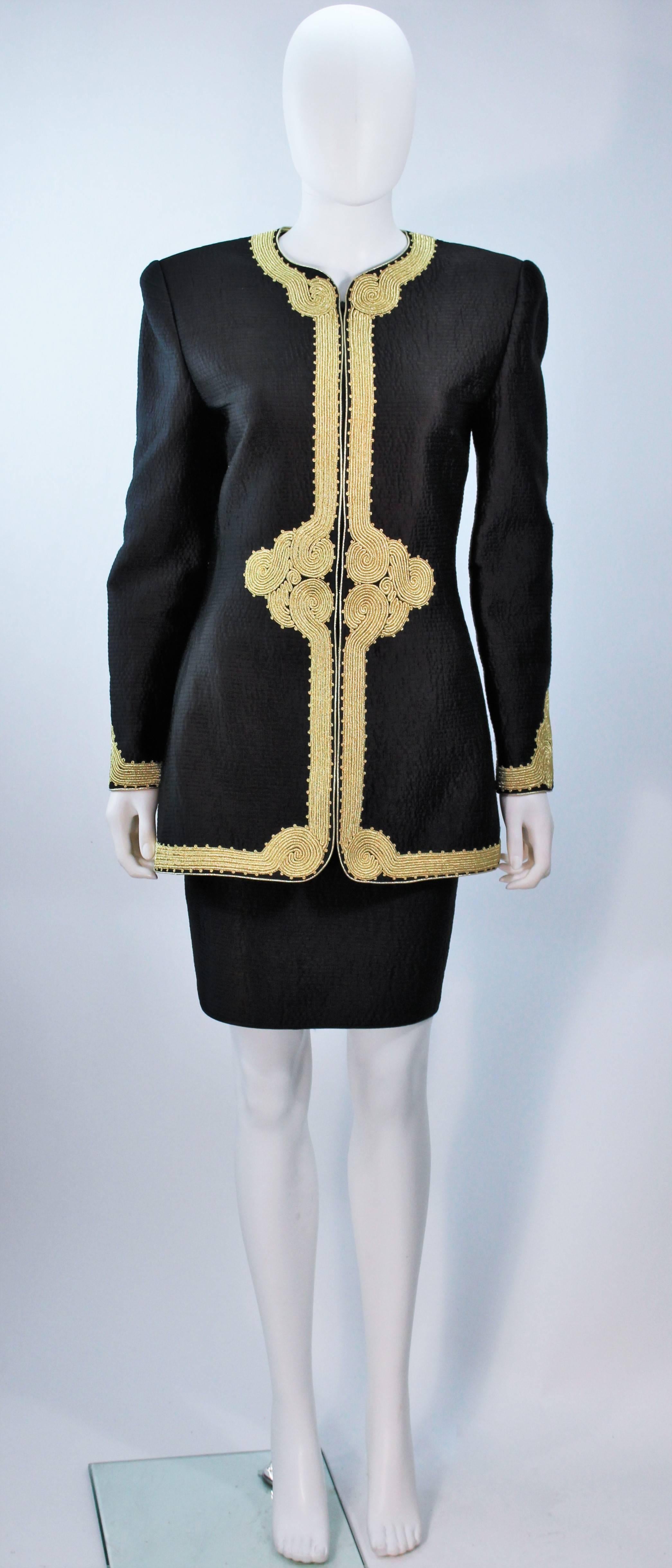  This Mary McFadden skirt suit is composed of a black silk with gold embroidery. The jacket has a center front zipper and the skirt has a side zipper. The skirt has a hiigh waist design. In excellent vintage condition. 

  **Please cross-reference