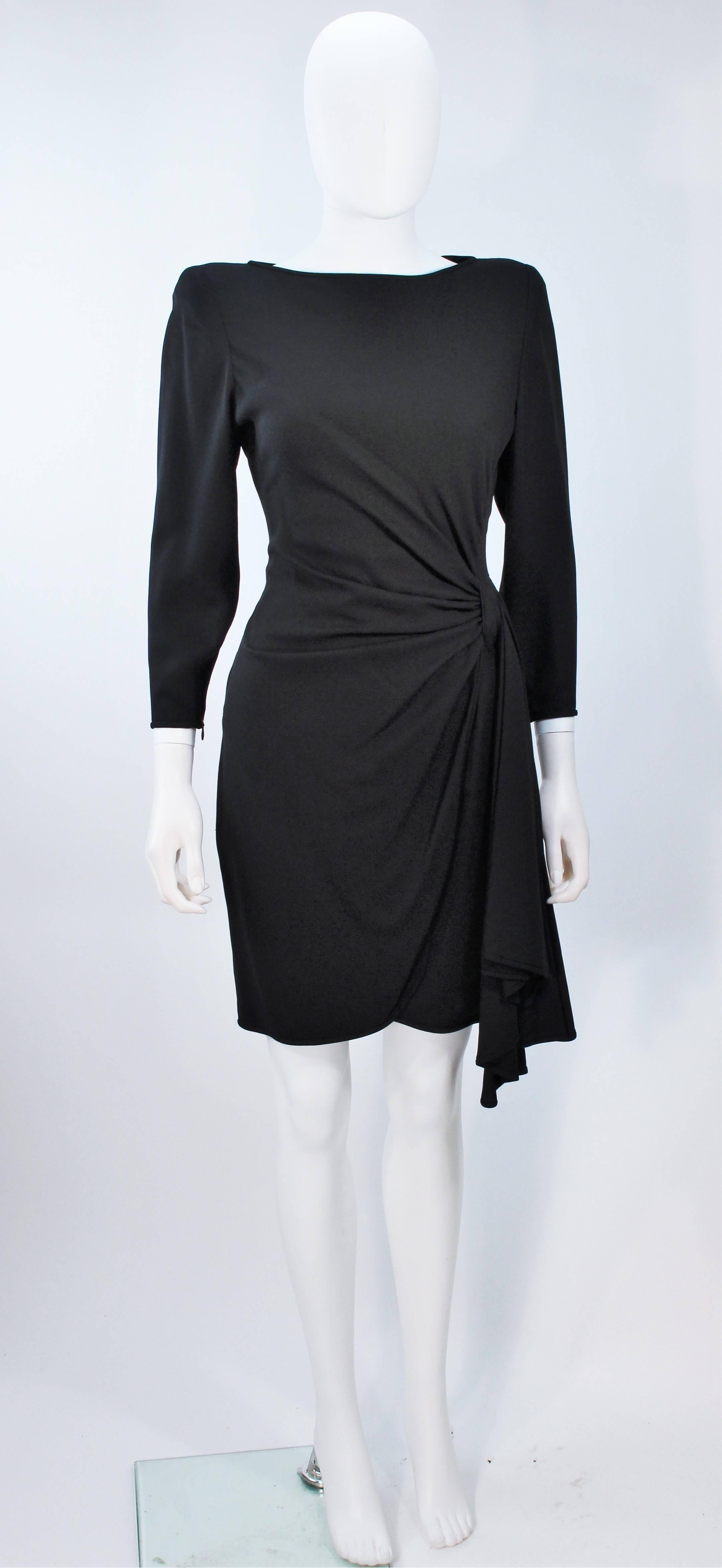  This Valentino dress is composed of a draped black fabric. There is a center back zipper closure. Wonderful design. In excellent vintage condition. 

  **Please cross-reference measurements for personal accuracy. Size in description box is an