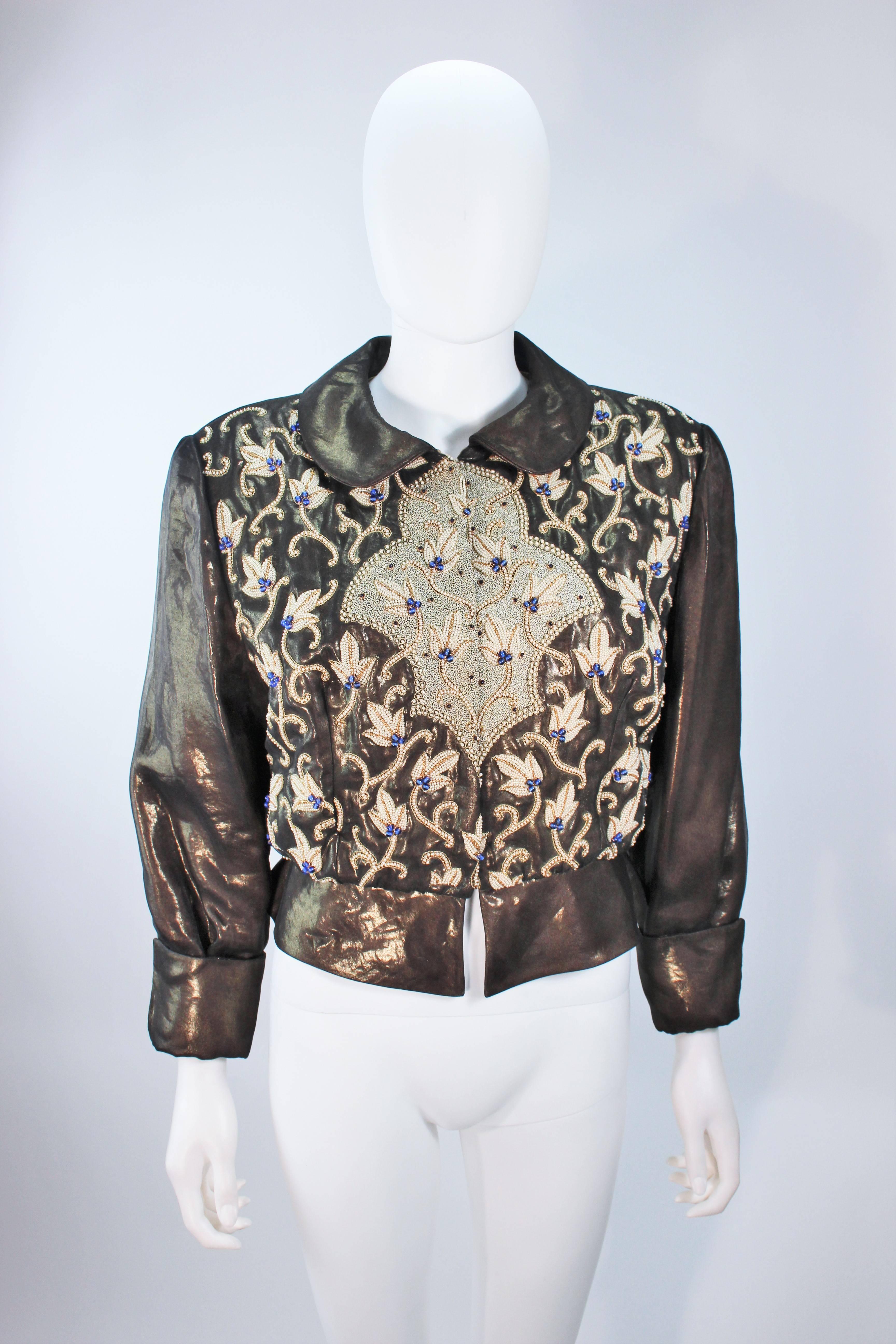  This Giorgio Armani jacket is composed of a bronze fabric with bead applique and embroidery. There are center front button closures. In excellent vintage condition. 

  **Please cross-reference measurements for personal accuracy. Size in