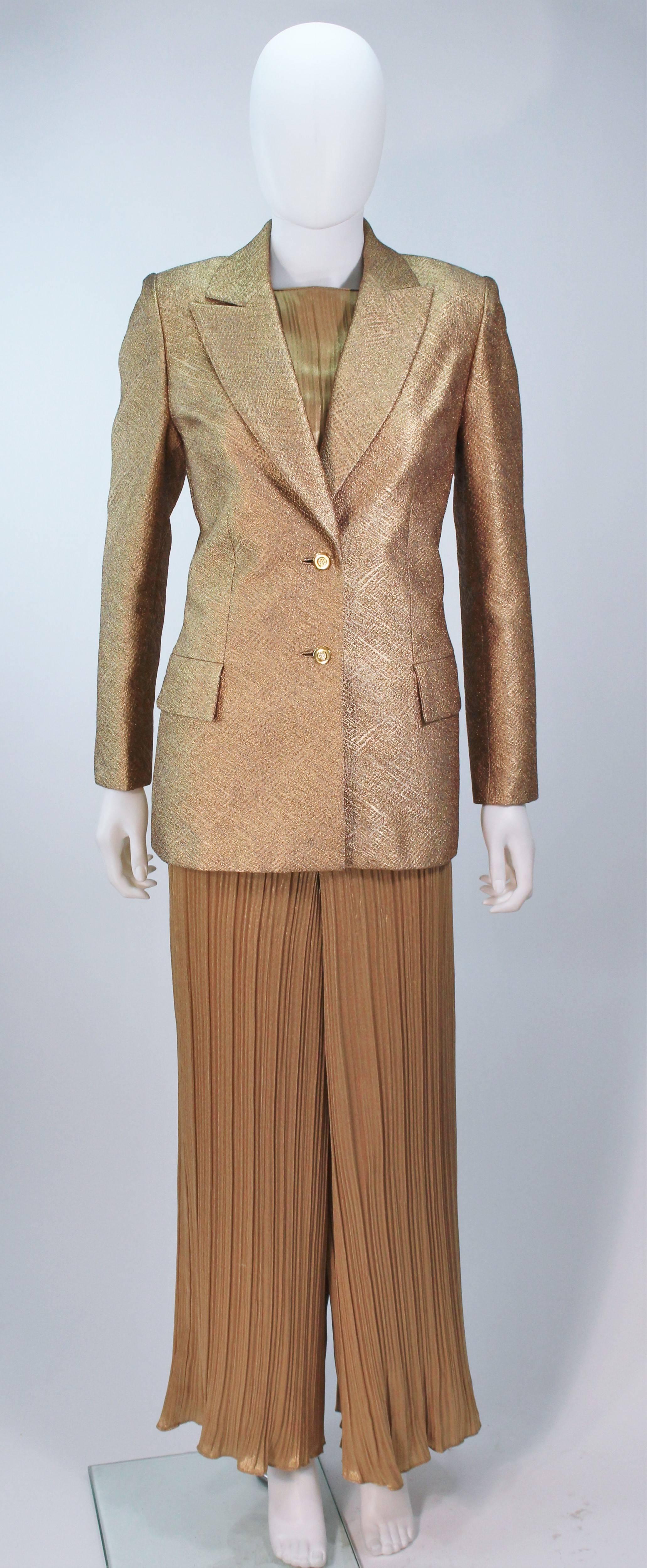  This Travilla pantsuit is composed of metallic silk Lame, with gold hardware. The jacket has center front button closures. The pants have a center back zipper closure. In excellent vintage condition. 

  **Please cross-reference measurements for