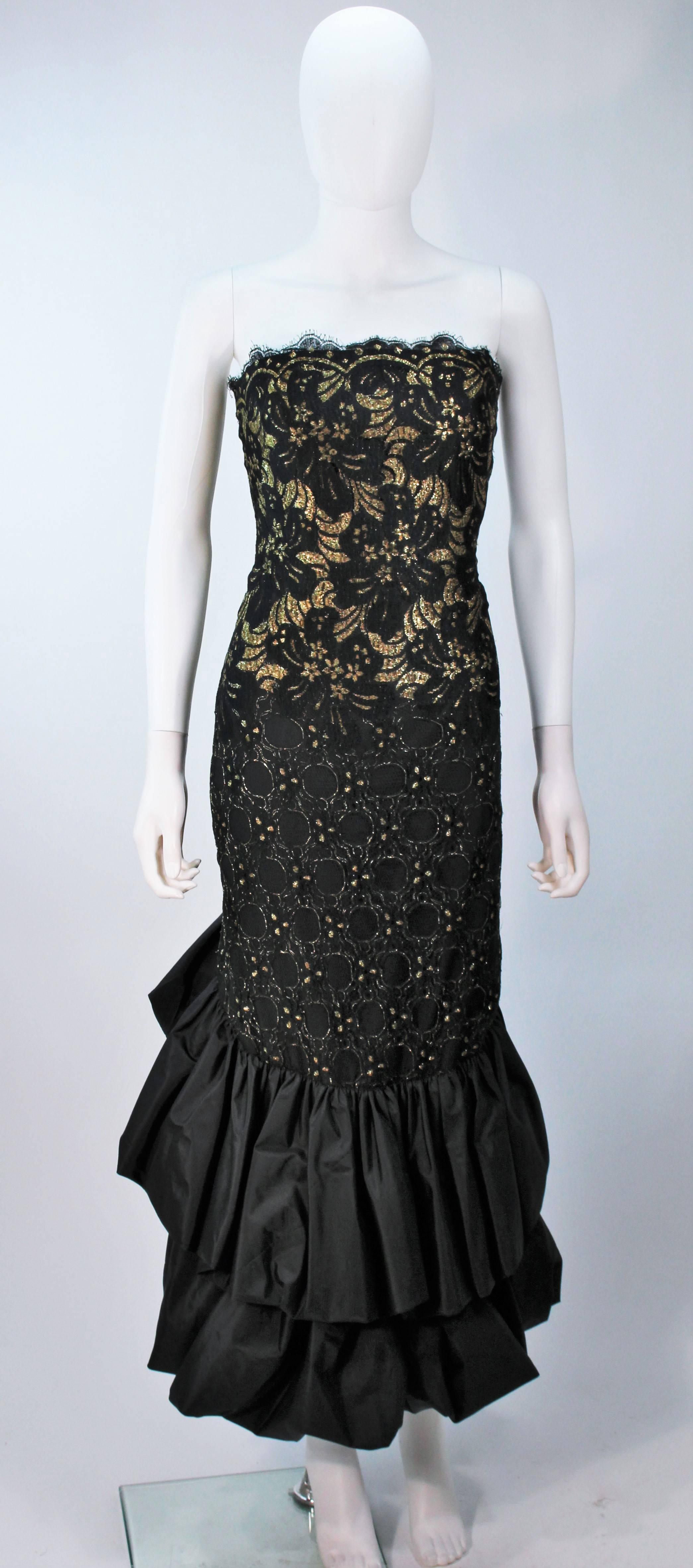  This Travilla gown is composed of a gold and black lace combination with puff taffeta hem. Features a scalloped edge, boning, and a center back zipper closure. In excellent vintage condition.

  **Please cross-reference measurements for personal