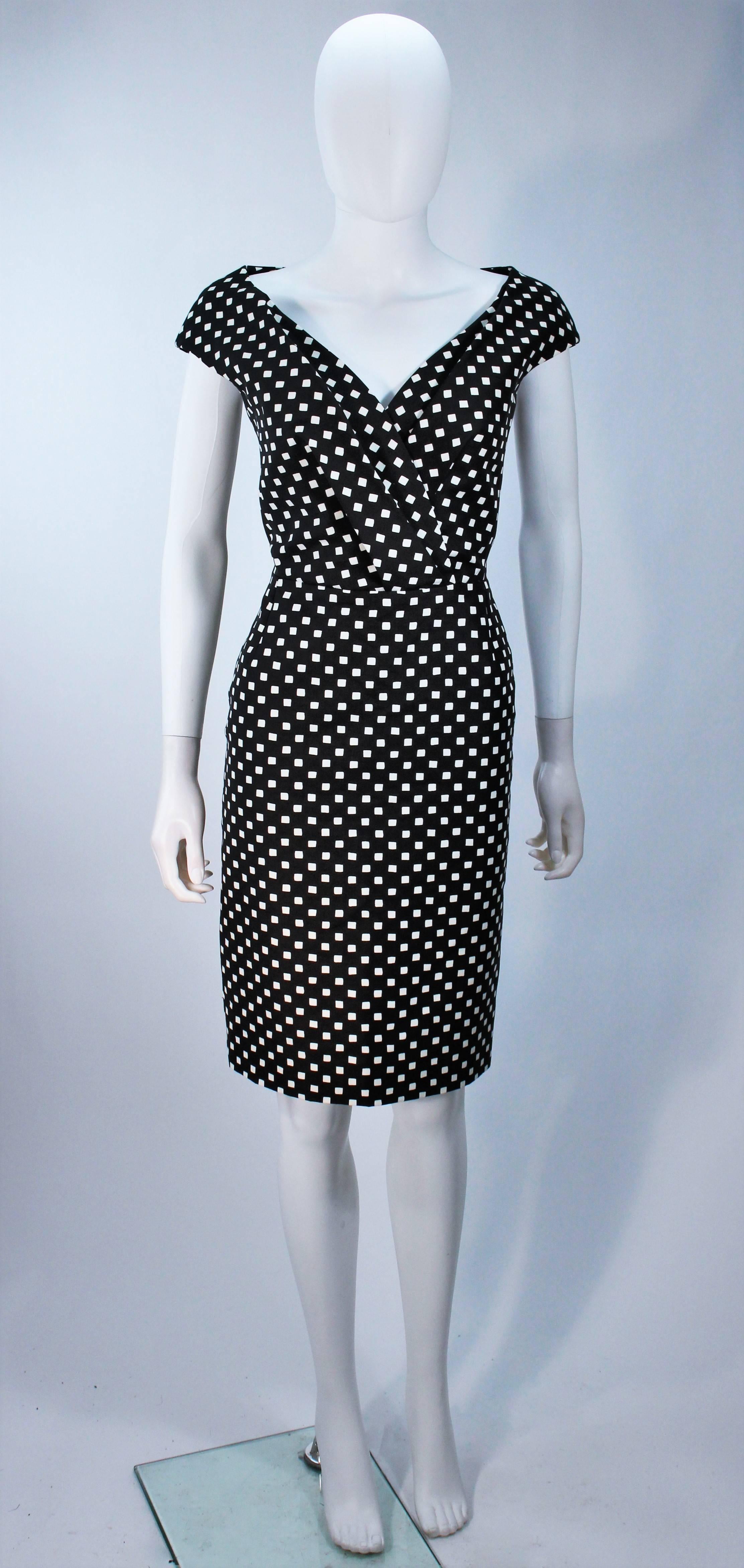  This Christian Dior design is available for viewing at our Beverly Hills Boutique. We offer a large selection of evening gowns and luxury garments. 

 This dress is composed of a black and white checkered fabric. Features a wide plunge neckline