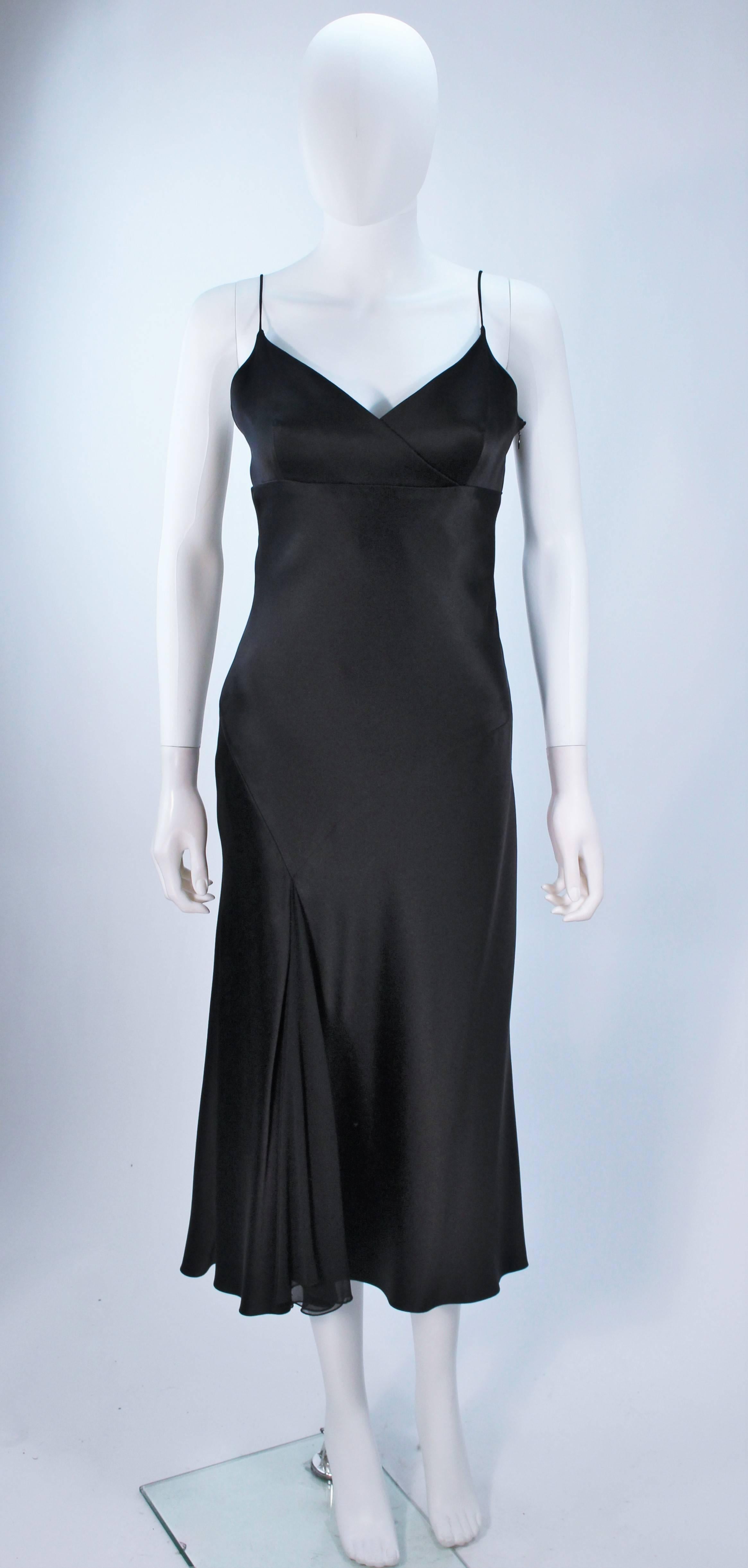  This Monique Lhuiller  dress is composed of a black silk with a silk chiffon accent. There is a zipper closure. In excellent condition. 

   **Please cross-reference measurements for personal accuracy. Size in description box is an