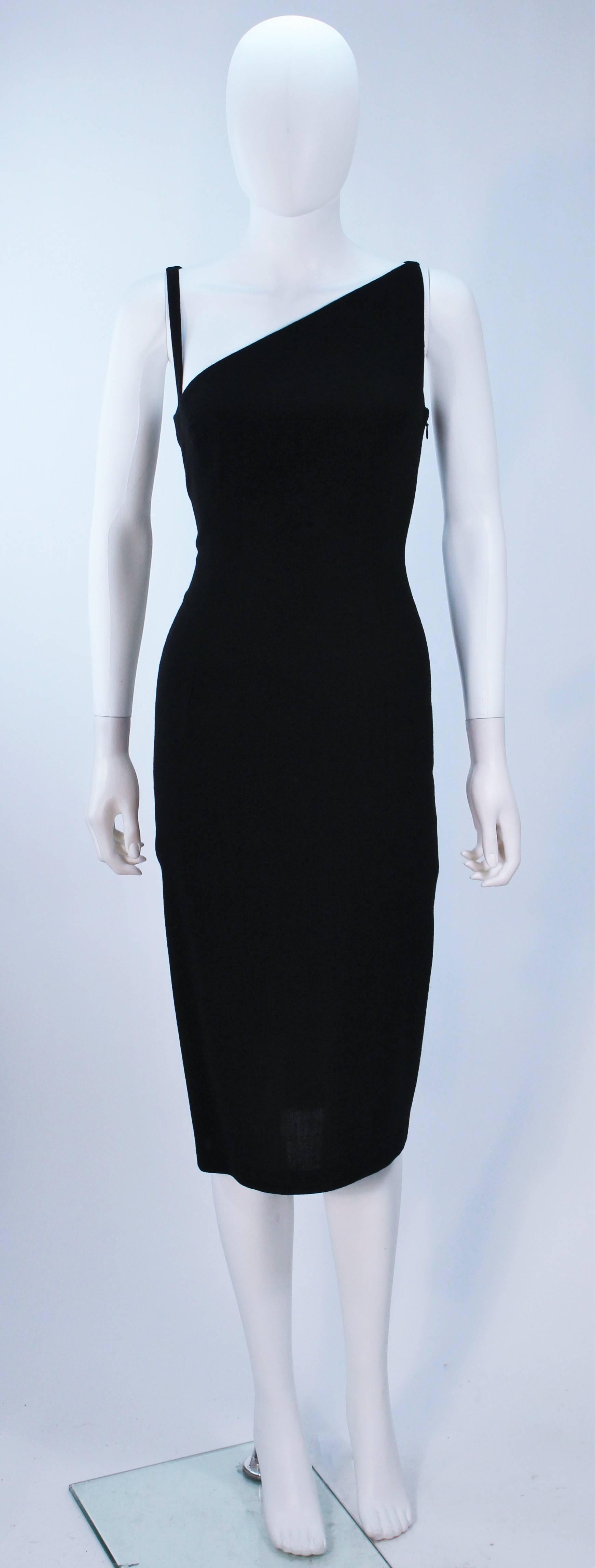 This John Galliano dress is composed of a black silk and features an asymmetrical design. There is a side zipper closure. In excellent] condition. 

**Please cross-reference measurements for personal accuracy.  

Measures