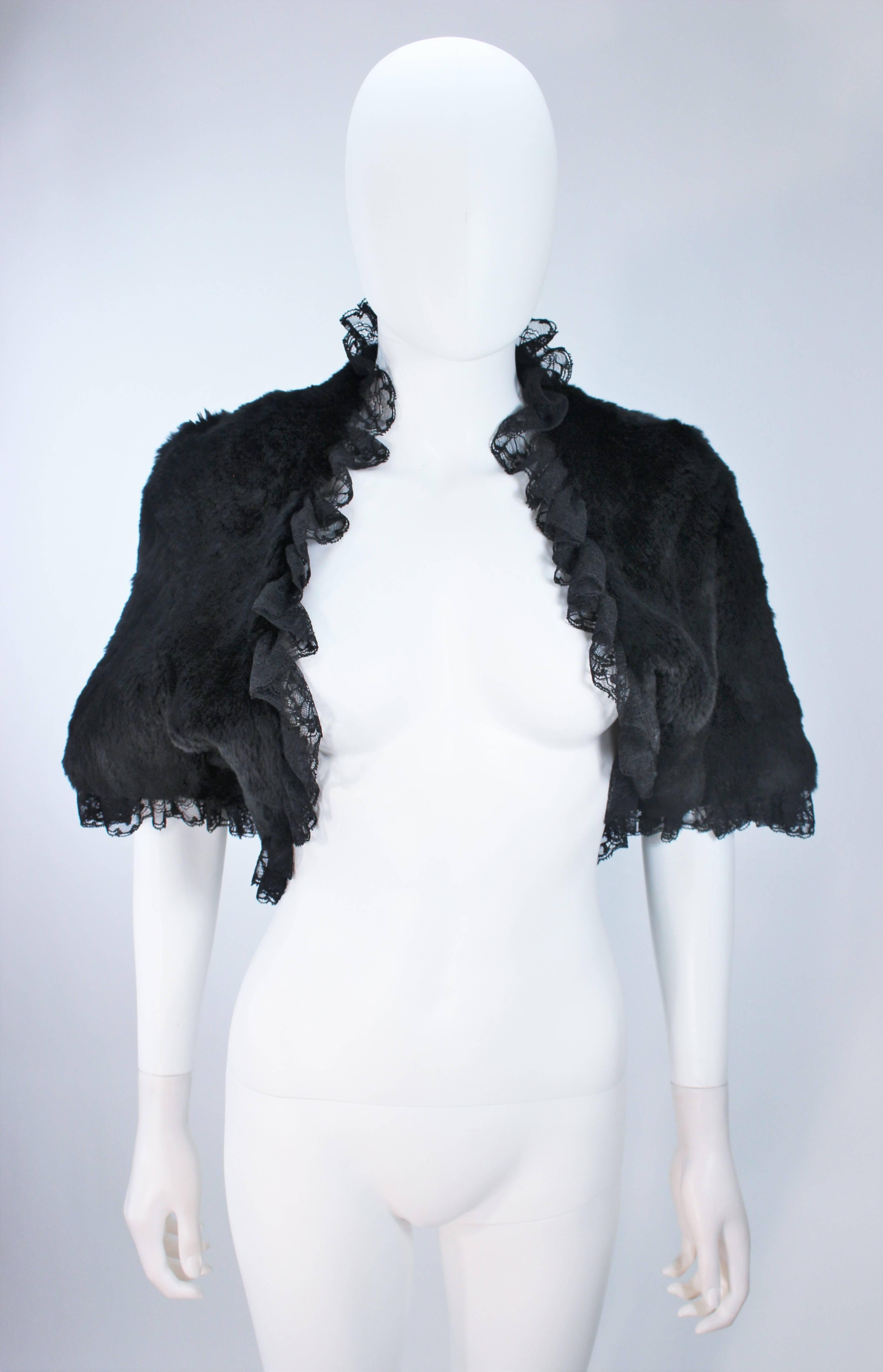  This ADRIENNE LANDAU  jacket is composed of a supple black rabbit and features a black lace trim. Open style. In excellent vintage condition. 

  **Please cross-reference measurements for personal accuracy. Size in description box is an