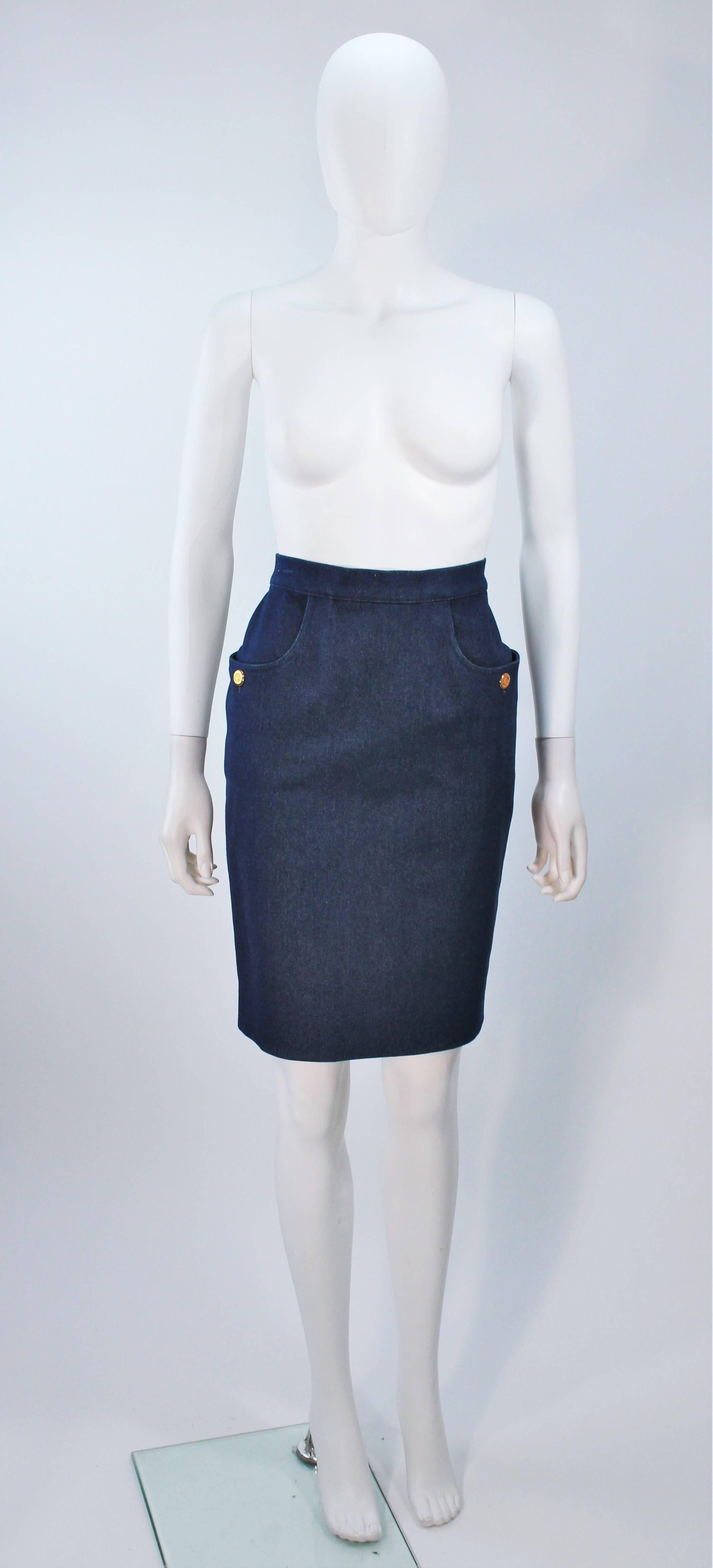  This Chanel skirt is composed of a blue heavy weight stretch denim. The classic pencil style skirt features a zipper closure, side pockets, and gold button accents. In excellent vintage condition. 

  **Please cross-reference measurements for