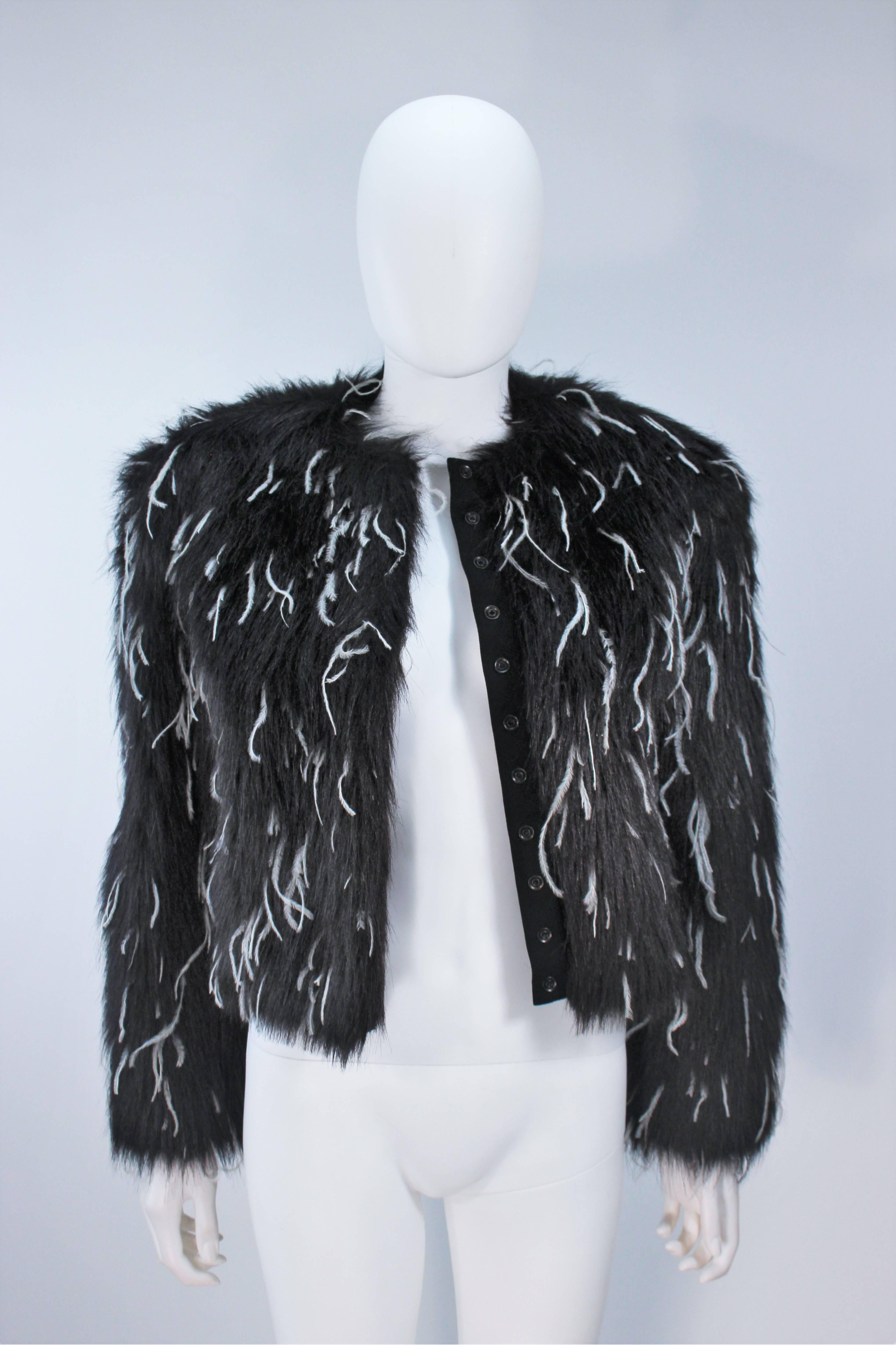  This Krizia  jacket is composed of a black faux fur with white ostrich feathers dotted in. There are center front snap button closures. In excellent vintage condition. 

  **Please cross-reference measurements for personal accuracy. 

Measures