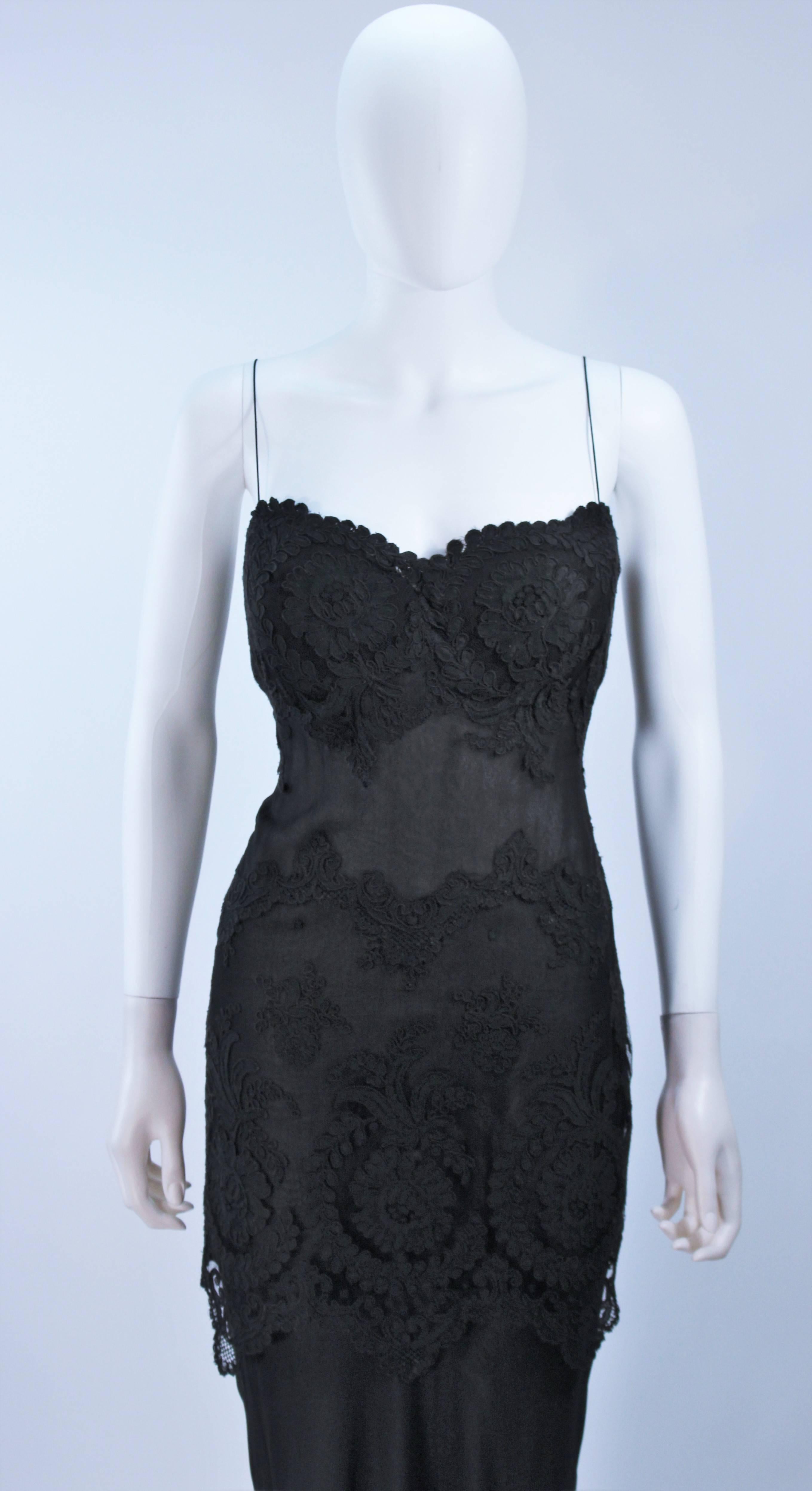  This Galanos dress is composed of a fine semi-sheer black silk chiffon with a lace applique. There is a center back zipper closure. In excellent vintage condition. 

  **Please cross-reference measurements for personal accuracy.

Measures