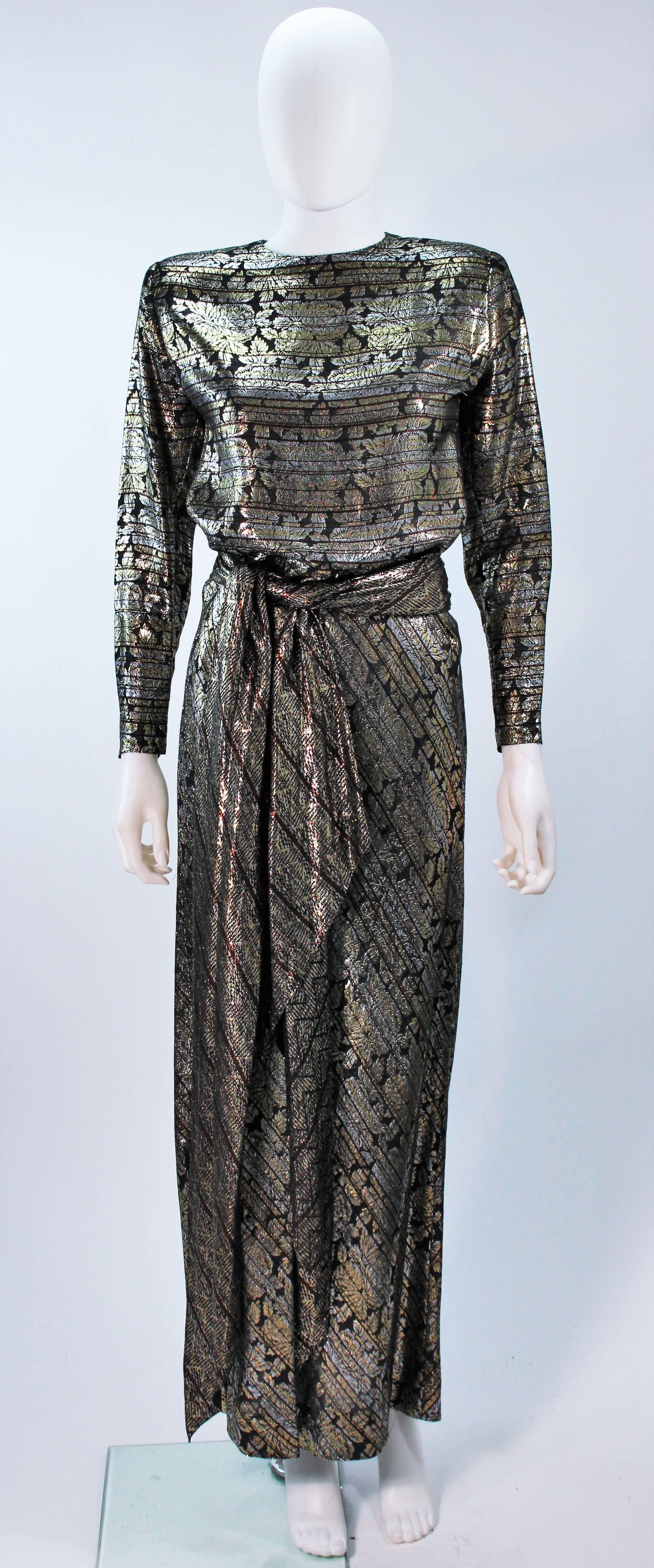  This Ron Leal  ensemble is composed of a metallic lame. The skirt portion of the dress features a bias cut. There is a  zipper closure and shoulder pads. In excellent vintage condition. 

  **Please cross-reference measurements for personal