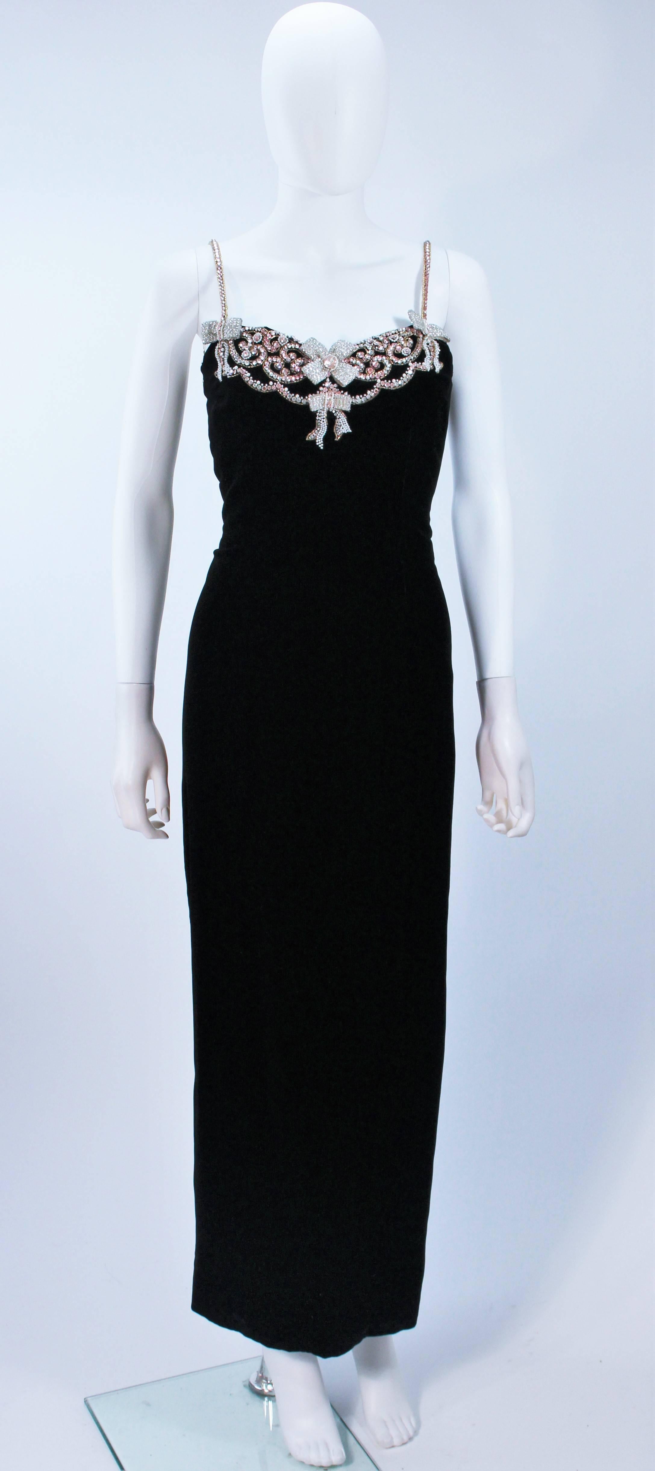  This Carolyn Roehm  gown is composed of a black velvet and features an embellished neckline with beaded straps. There is a zipper closure. In excellent vintage condition. 

  **Please cross-reference measurements for personal accuracy. Size in