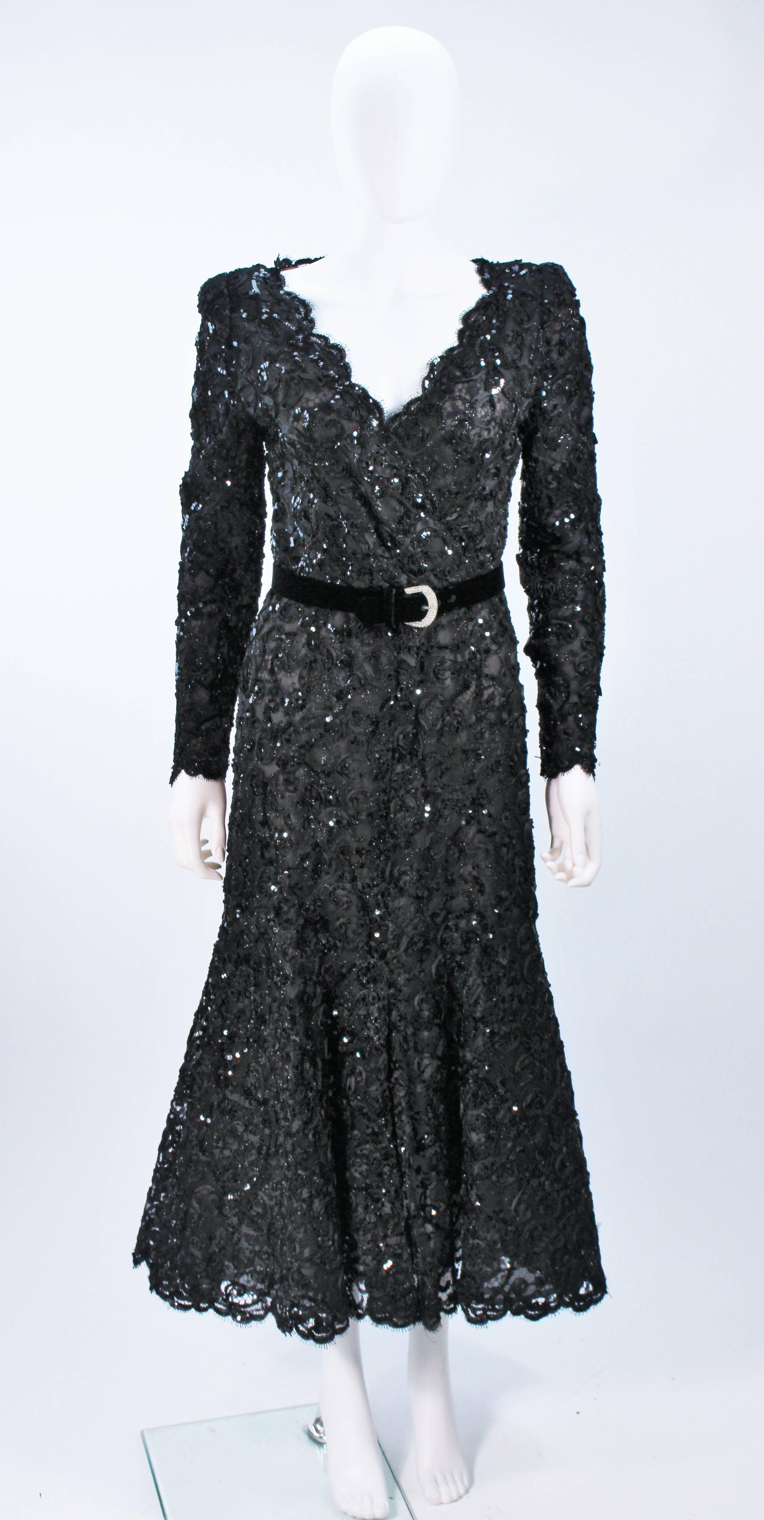  This Oscar De La Renta dress is composed of a sequin black lace with scalloped edging. There is a center back zipper closure. Belt has rhinestone buckle. In excellent vintage condition. 

  **Please cross-reference measurements for personal