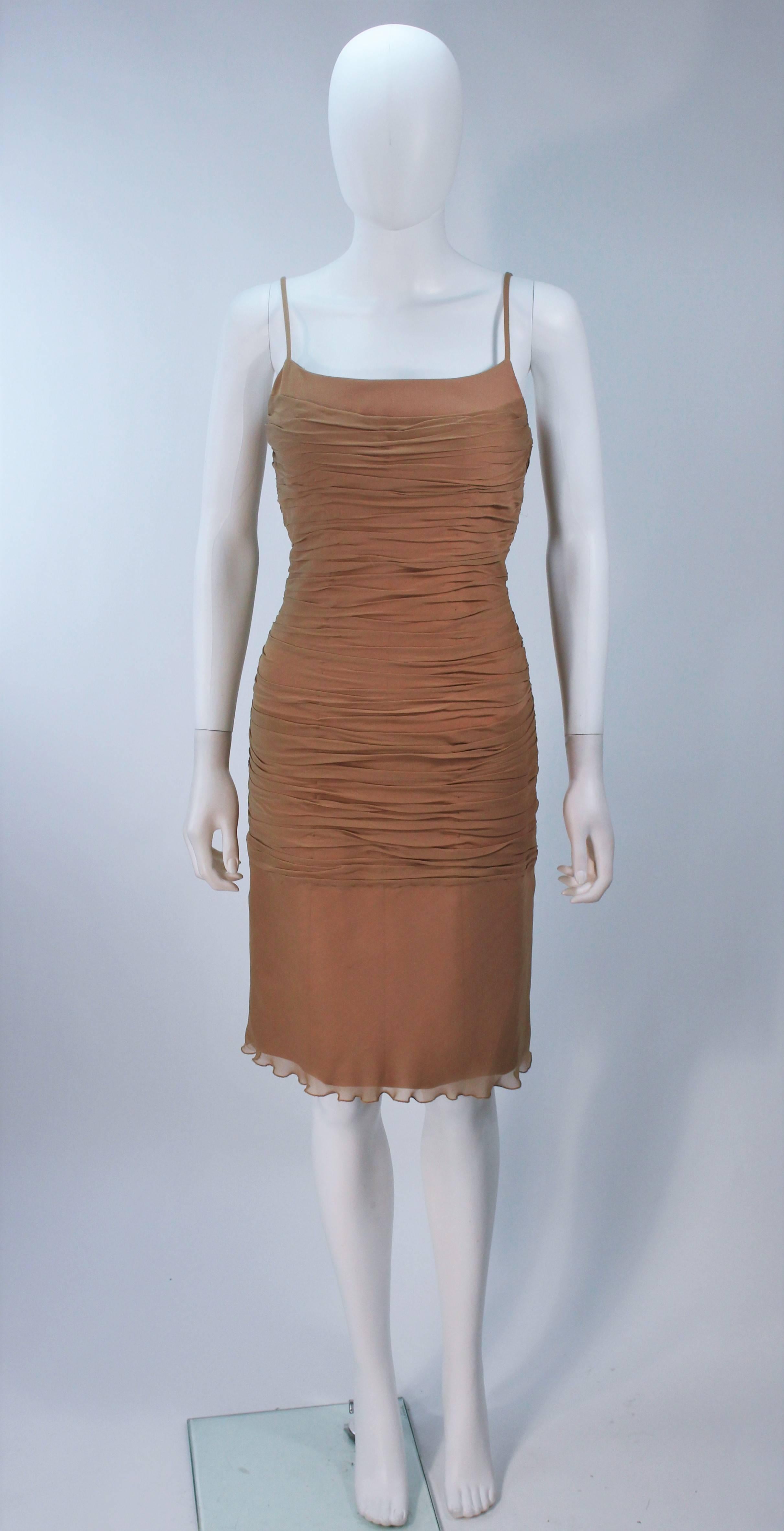 This Galanos  cocktail dress is composed of a nude/camel silk chiffon. Features a ruched design with spaghetti straps, and side zipper closure. In excellent vintage condition. 

  **Please cross-reference measurements for personal accuracy. Size