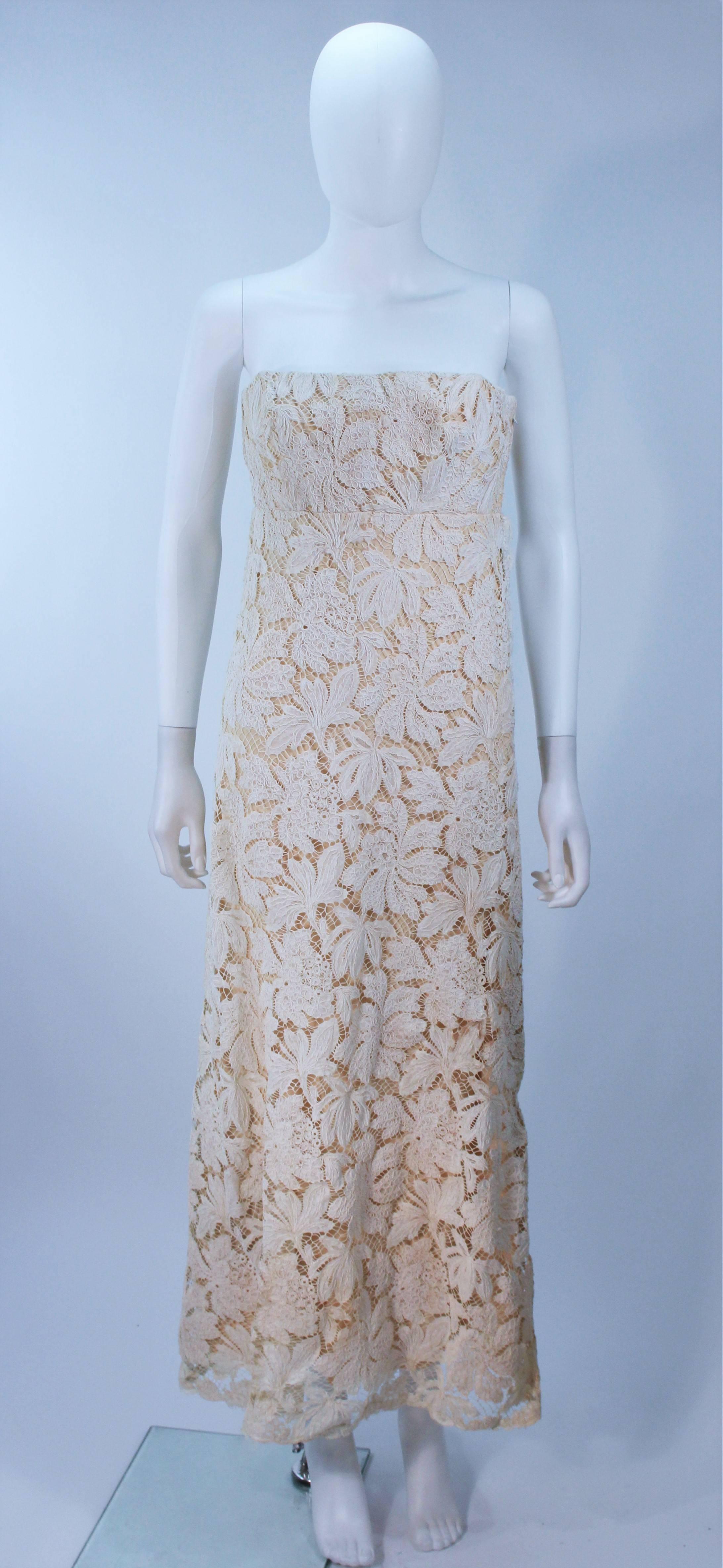  This Galanos  dress is composed of an off white-cream hue floral patterned lace with silk lining. There is a side zipper closure. In excellent great condition, the material is in an antique state and relatively fragile due to age. 

  **Please
