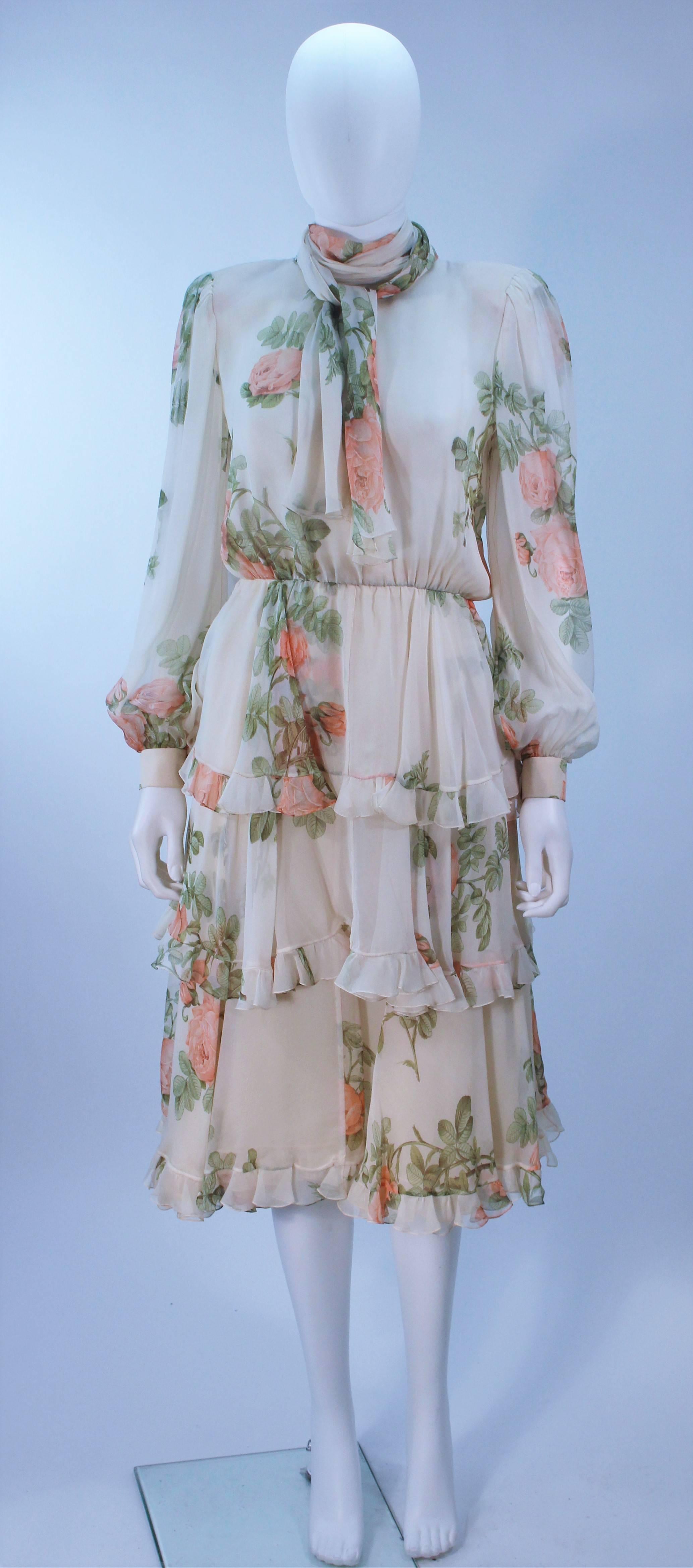  This Valentino design is available for viewing at our Beverly Hills Boutique. We offer a large selection of evening gowns and luxury garments. 

 This skirt set is composed of an off white and pink silk chiffon with a floral pattern, and ruffled