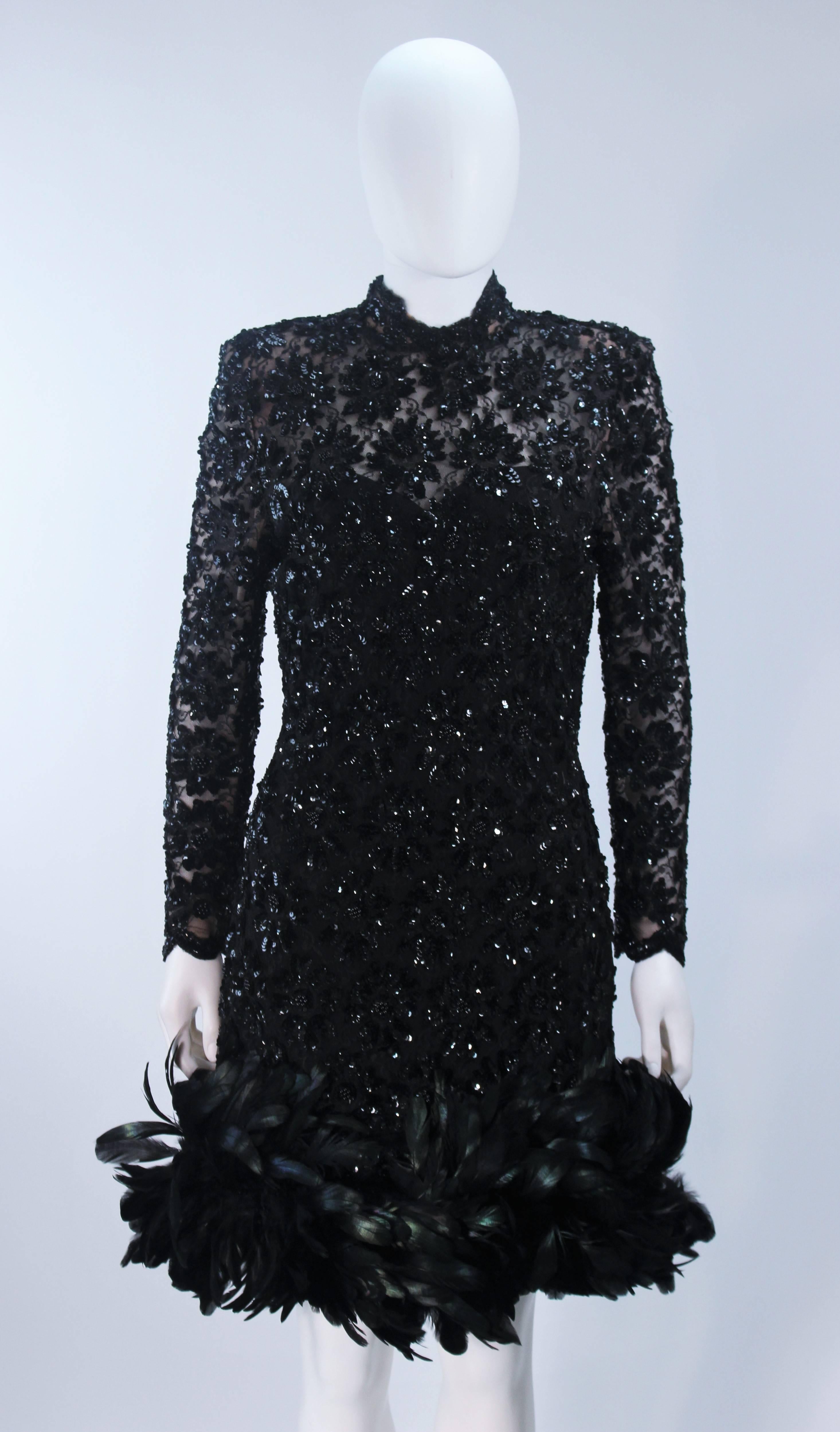  This Travilla  dress is composed of a fine black beaded and sequin embellished lace, with an black iridescent feather trim. There is a center back zipper closure. In excellent vintage condition. 

  **Please cross-reference measurements for