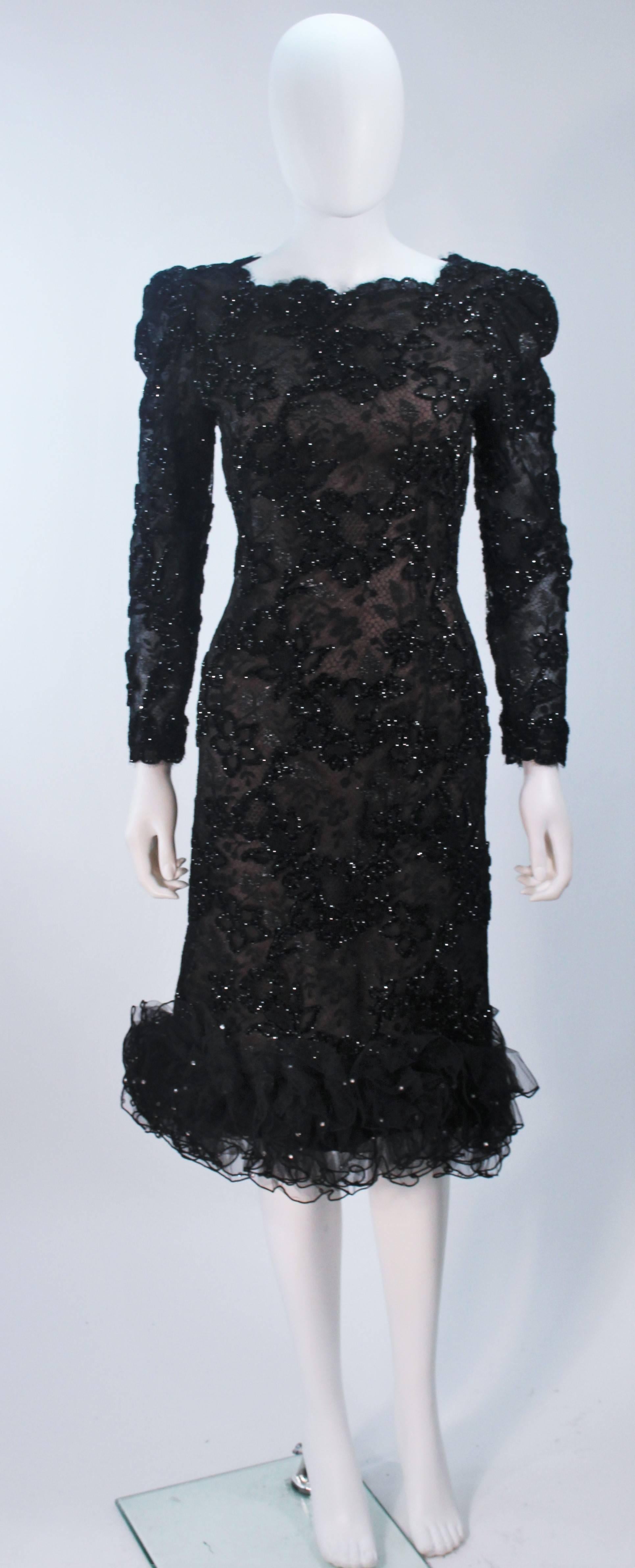  This Oscar De La Renta  cocktail dress is composed of a black lace combination with nude base. Features a ruffled hem with rhinestones splashed throughout the hem. There is a center back closure. In excellent vintage condition.

  **Please