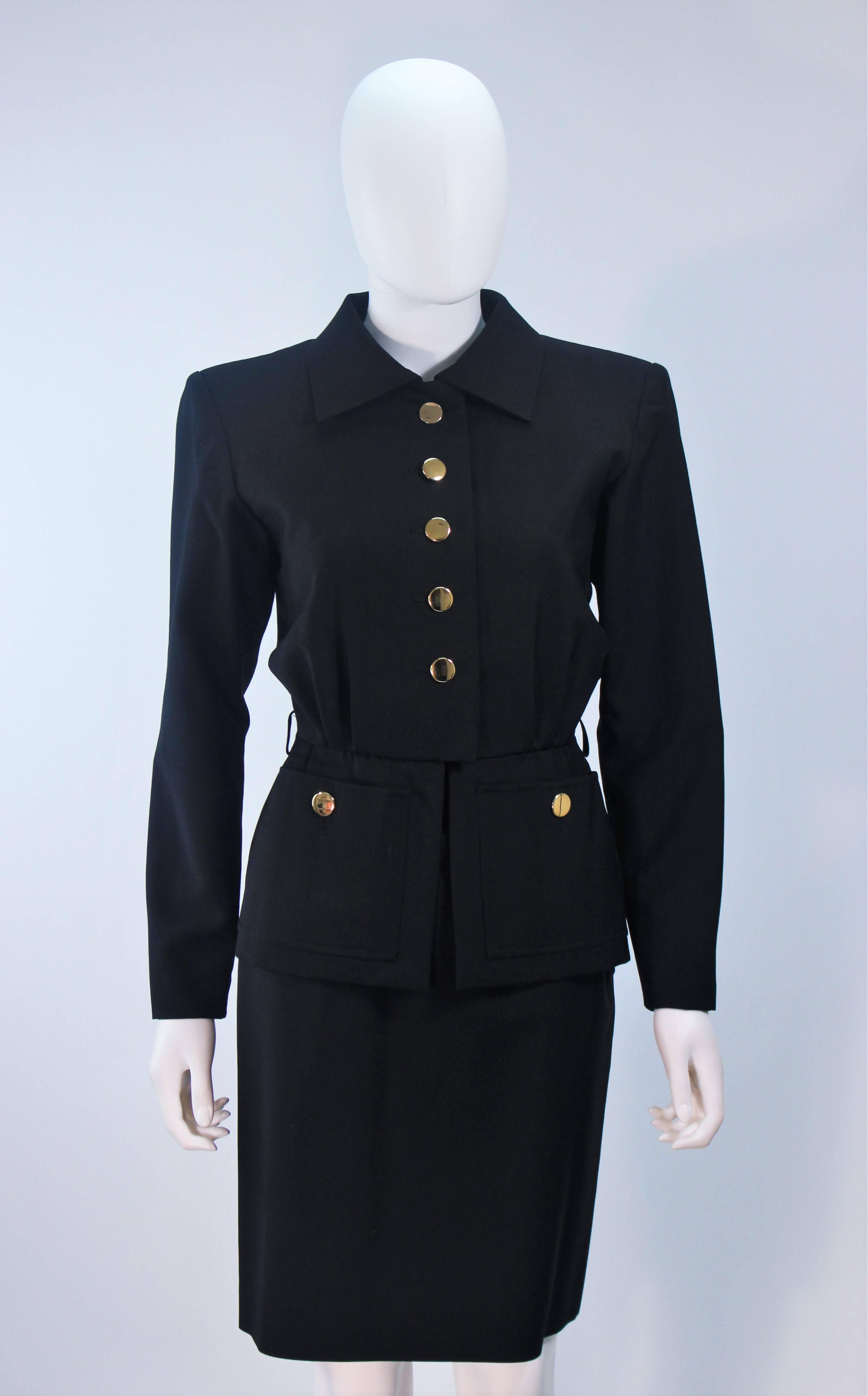  This Yves Saint Laurent skirt suit is composed of a black wool and mohair blend. The jacket features center front button closures with pockets and peplum style. The skirt has a side zipper closure. In excellent vintage condition. 

  **Please