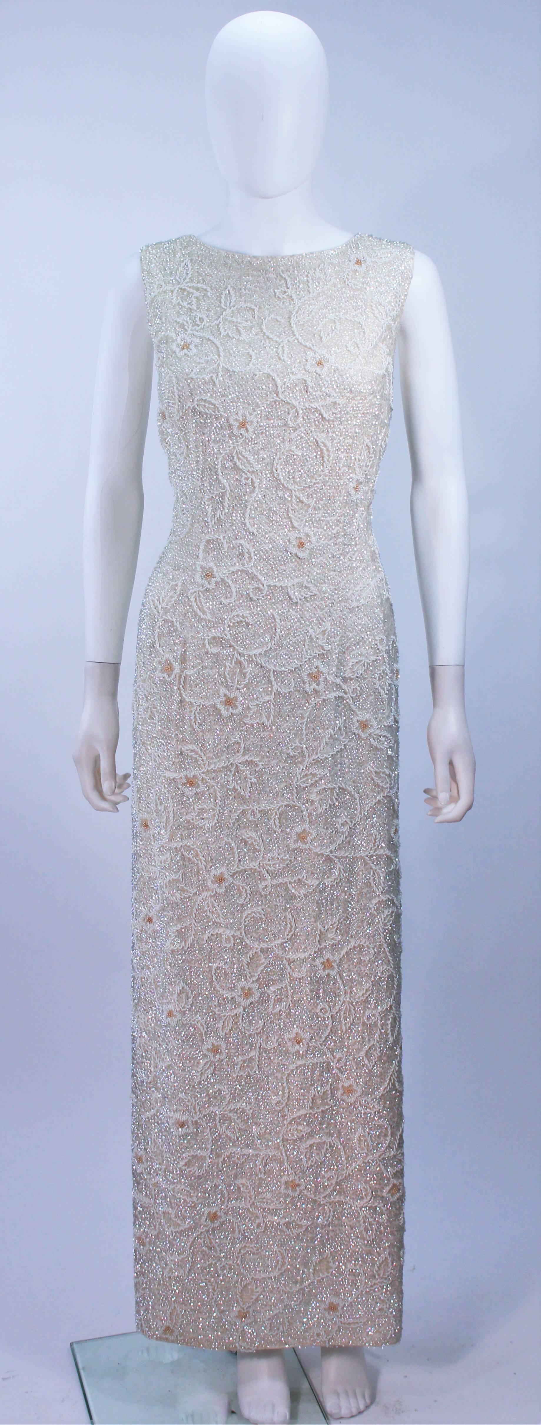  This gown is composed of an off white iridescent beaded and sequin fabric, with a floral pattern. There is a center back zipper closure. In excellent vintage condition. 

  **Please cross-reference measurements for personal accuracy. 

Measures