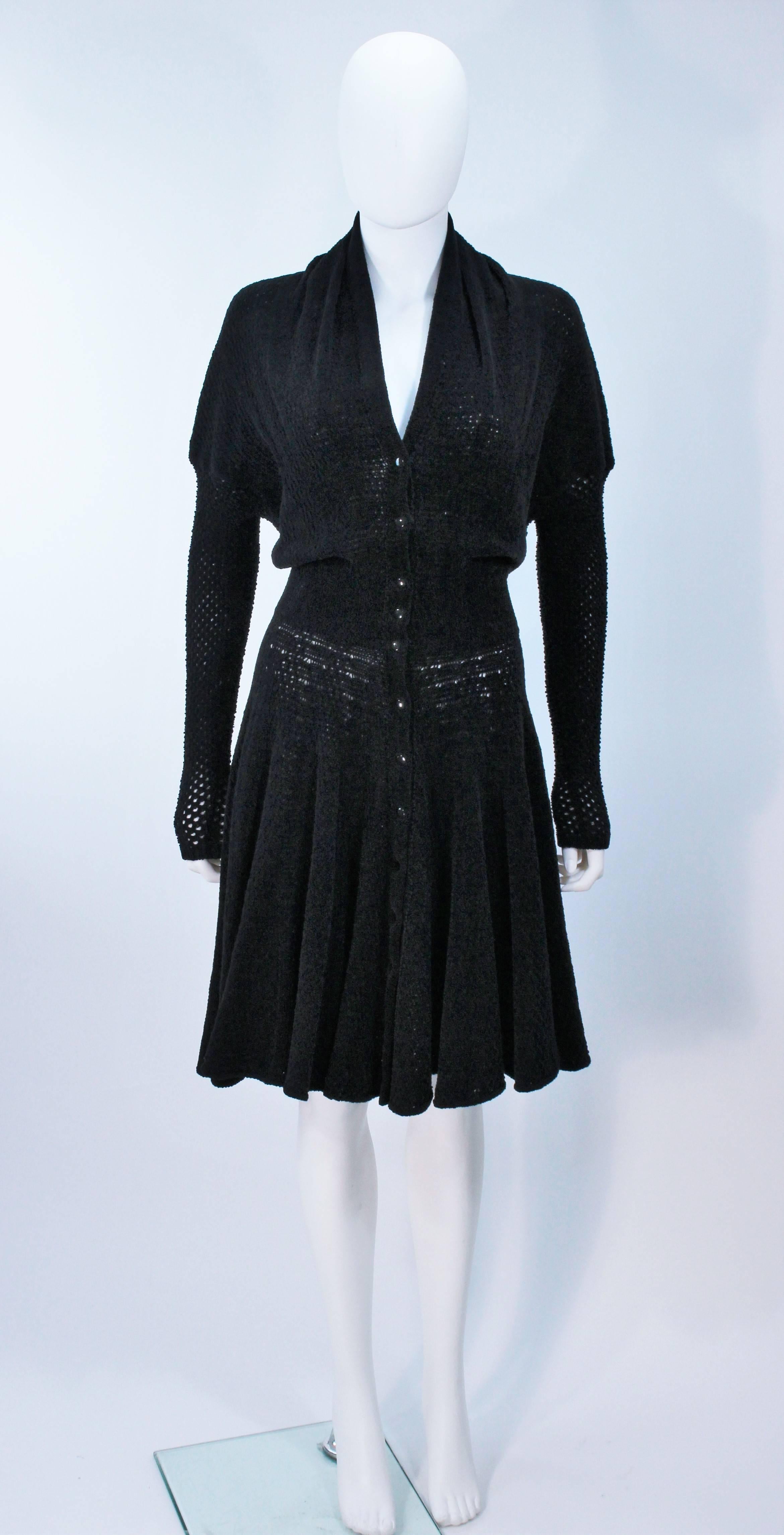 ALAIA Vintage Black Soft Chenille Stretch Dress or Coat .
Size XS (
Rayon/viscose blend soft Chenille knit. 
Features dolman style sleeves and center front snaps. In excellent vintage condition. 
This piece can easily be worn as a dress, or as a