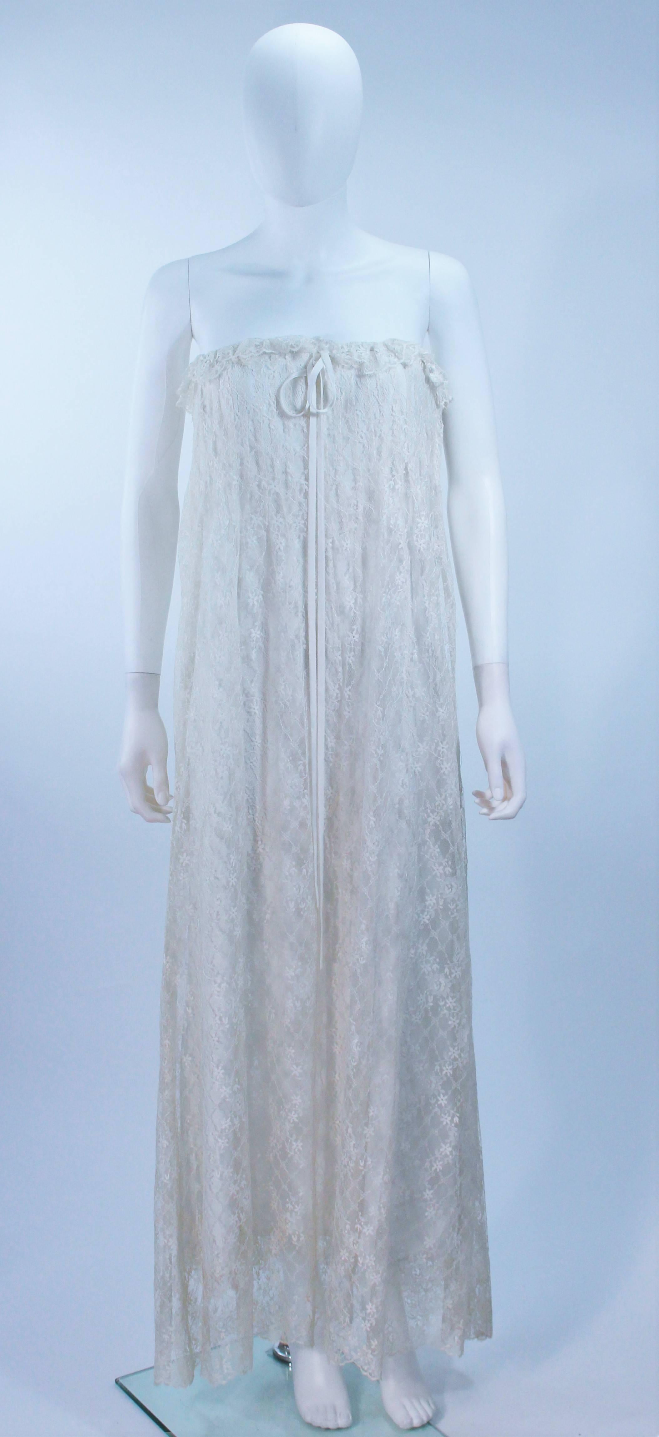  This Bill Blass dress is composed of a white lace with a ruffled trim and satin bow detail. There is a side zipper closure. In excellent vintage condition. 

  **Please cross-reference measurements for personal accuracy. Size in description box