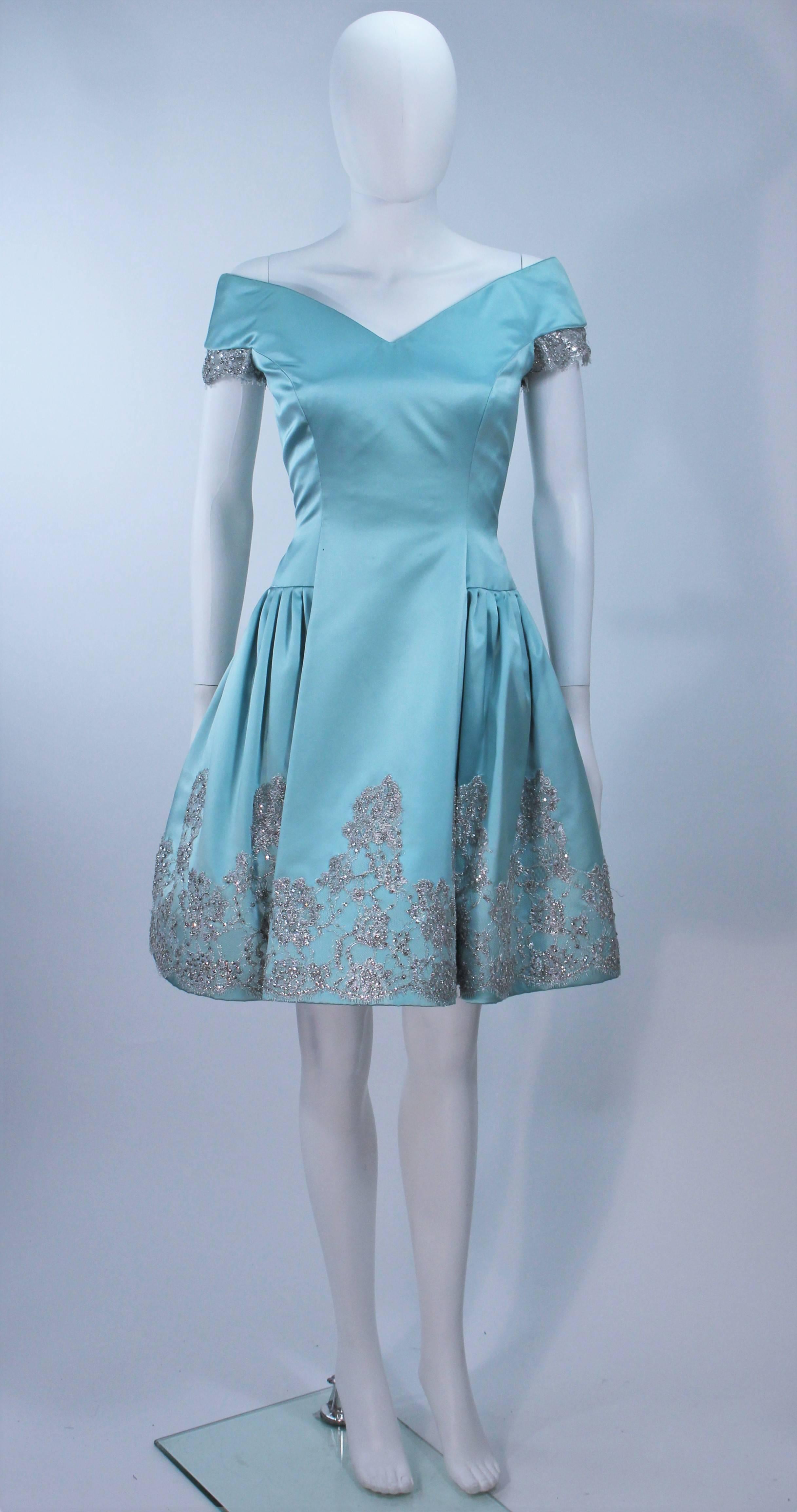  This Vera Wang  gown is composed of blue silk with embellished silver lace trim . There is a center back zipper closure and interior boning. In excellent vintage condition. 

  **Please cross-reference measurements for personal accuracy. Size in