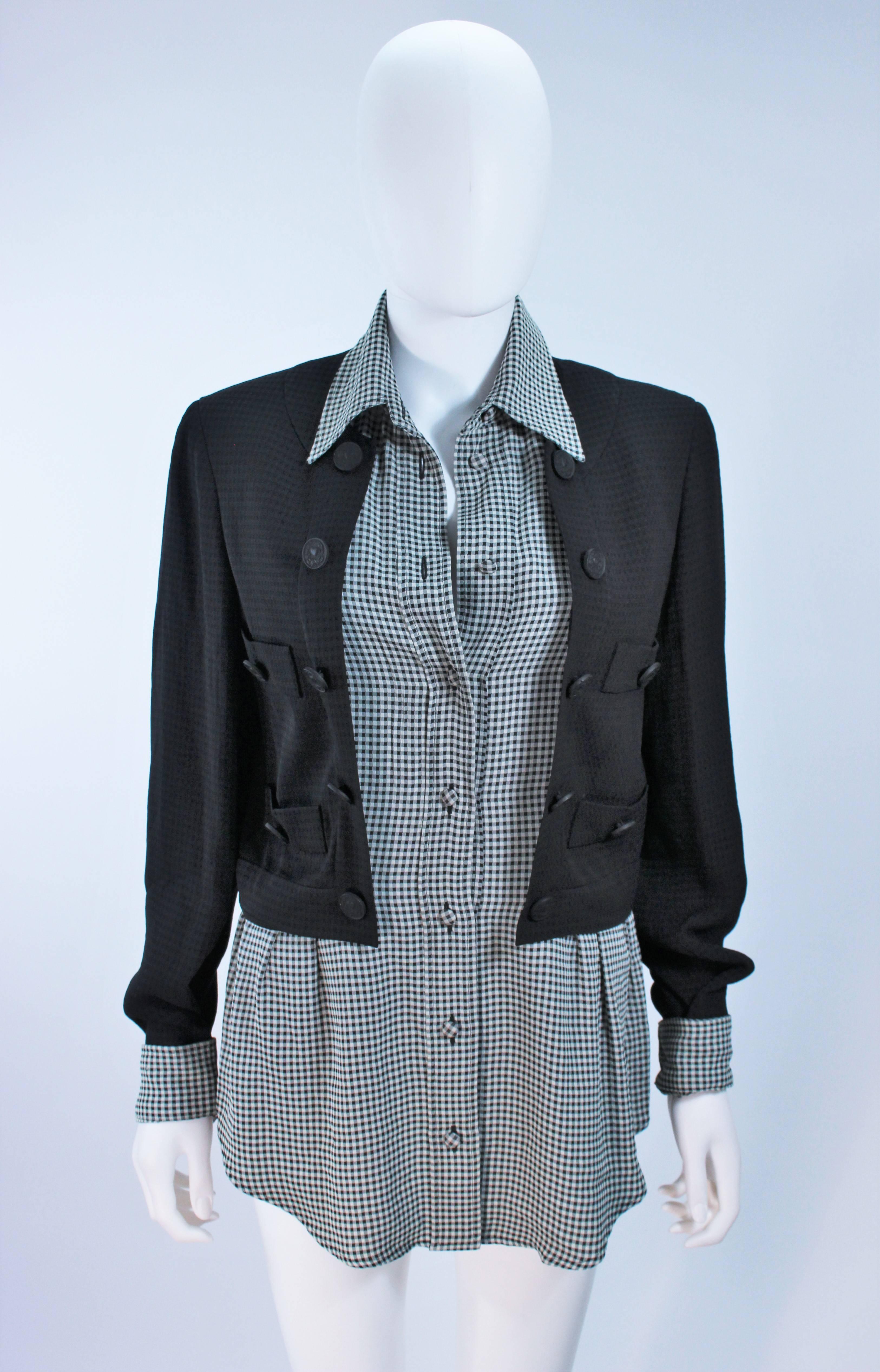  This Moschino jacket is composed of a black exterior jacket and features a plaid silk interior attached shirt. There are center front button closures. In great vintage condition. 

  **Please cross-reference measurements for personal accuracy.