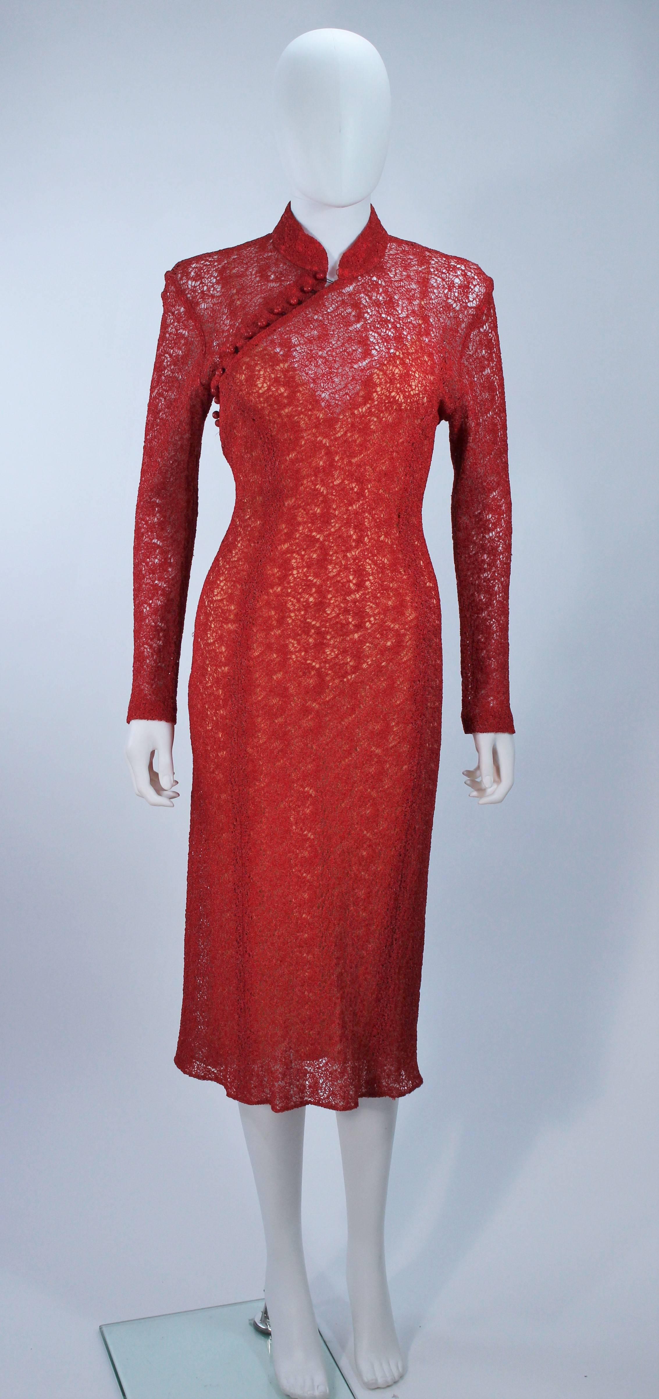  This Monique Lhuillier cocktail dress is composed of a stretch sheer lace material and stretch bias cut silk slip. There is a side zipper closure with buttons at the neck. In excellent vintage condition. 

  **Please cross-reference measurements
