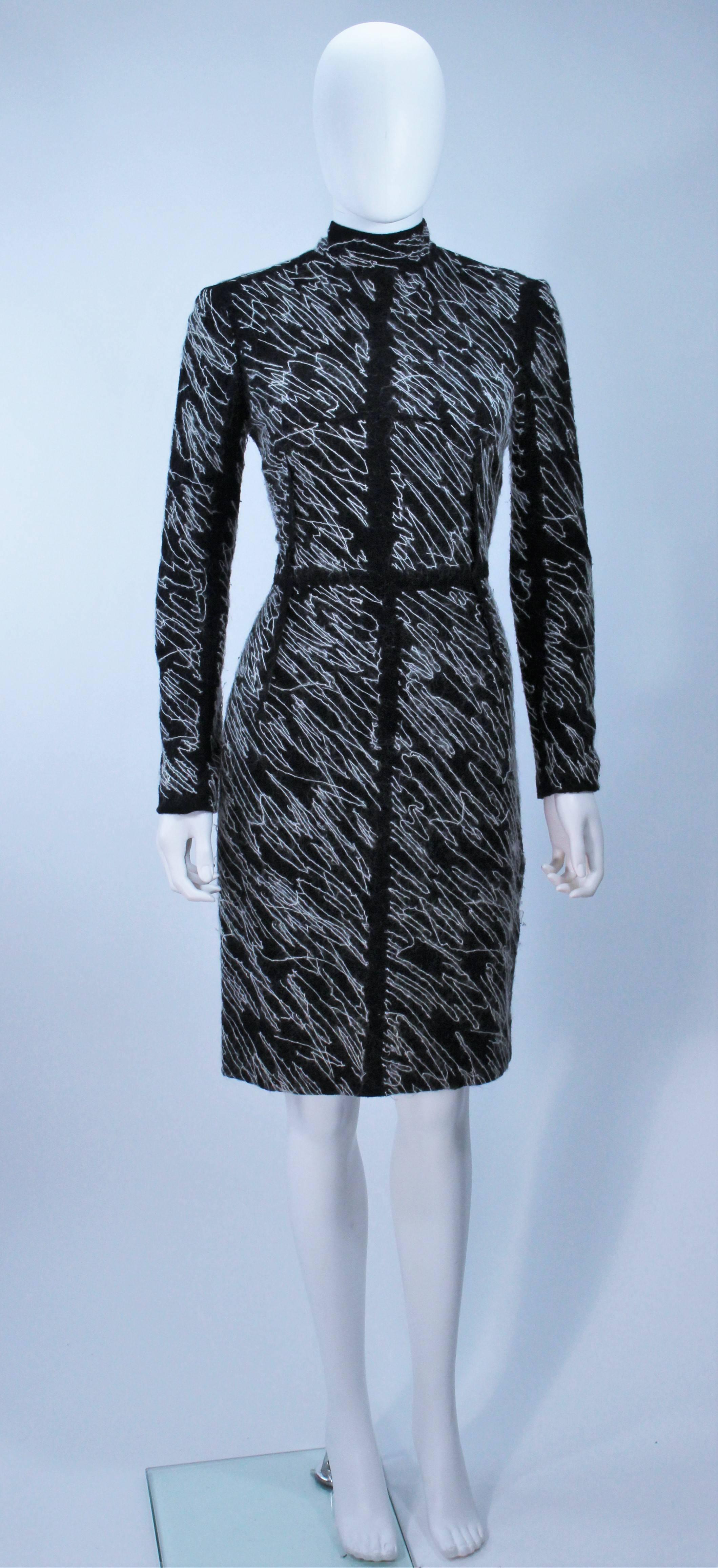  This Proenze Schouler  cocktail dress is composed of a black wool with a white wool thread in an abstract pattern. There is a center back zipper closure. In excellent vintage condition. 

Measures (Approximately)
Length: 38.5