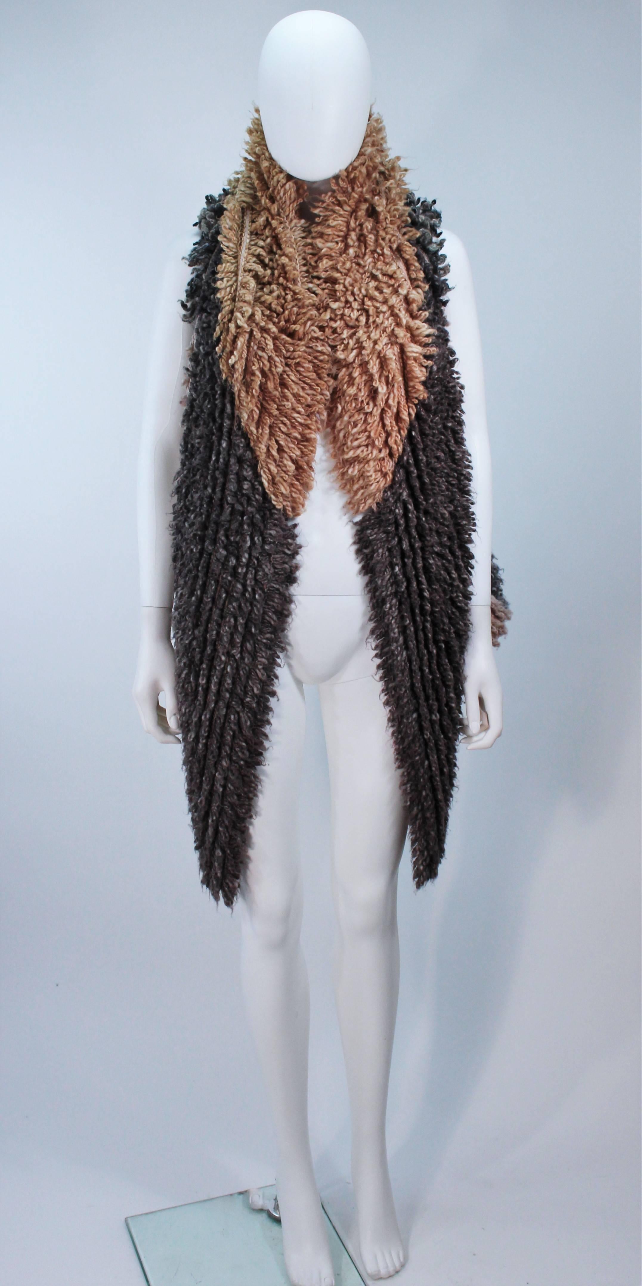  This Missoni  vest is composed of a grey and caramel shaggy material. Features an open style front. In great, like new condition. 

  **Please cross-reference measurements for personal accuracy. Size in description box is an