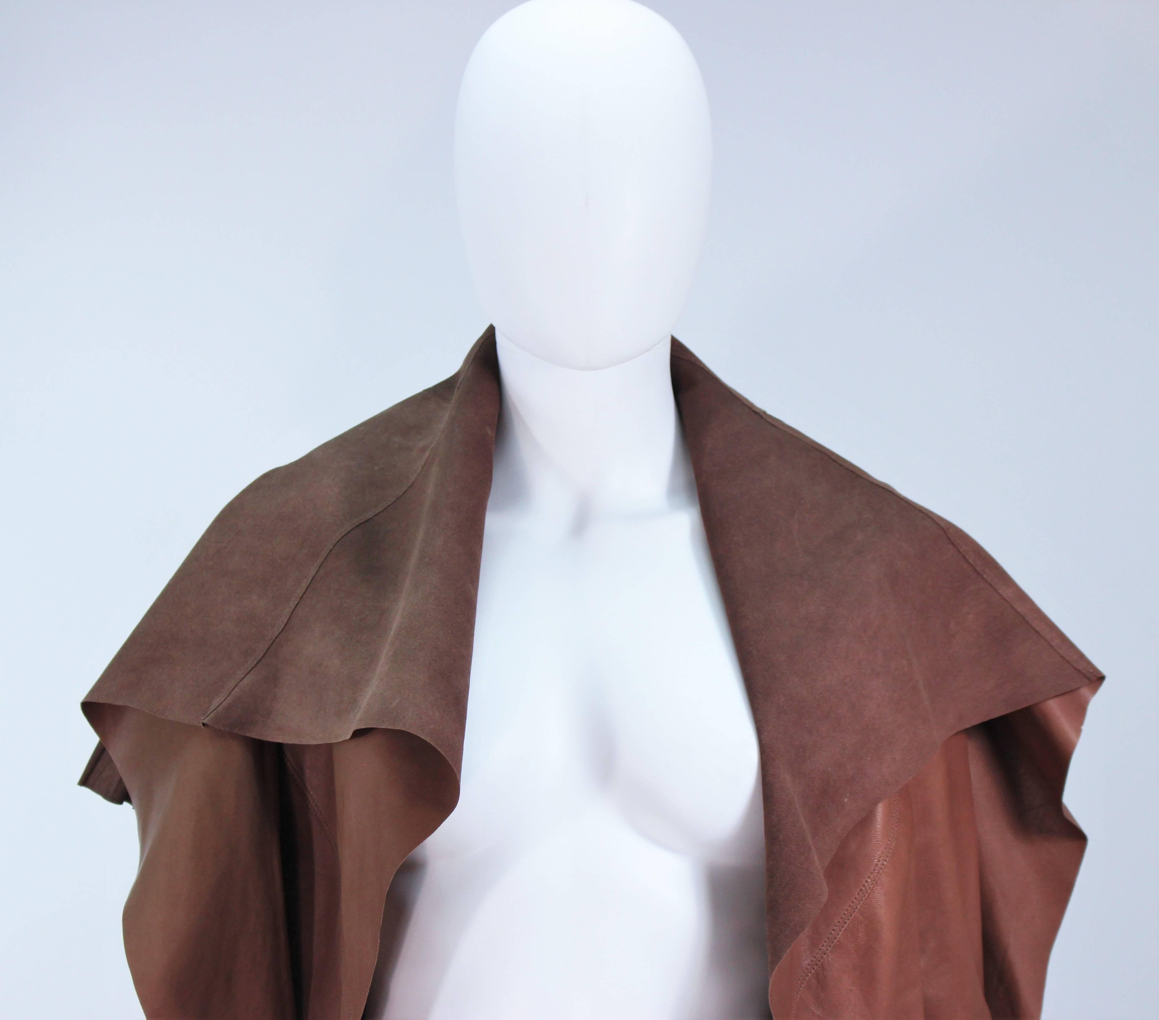  This Rick Owens  jacket is composed of a brown supple lamb leather. Features an open style with back drape and pleating. Excellent and easily chic. In great like new condition. 

  **Please cross-reference measurements for personal accuracy.