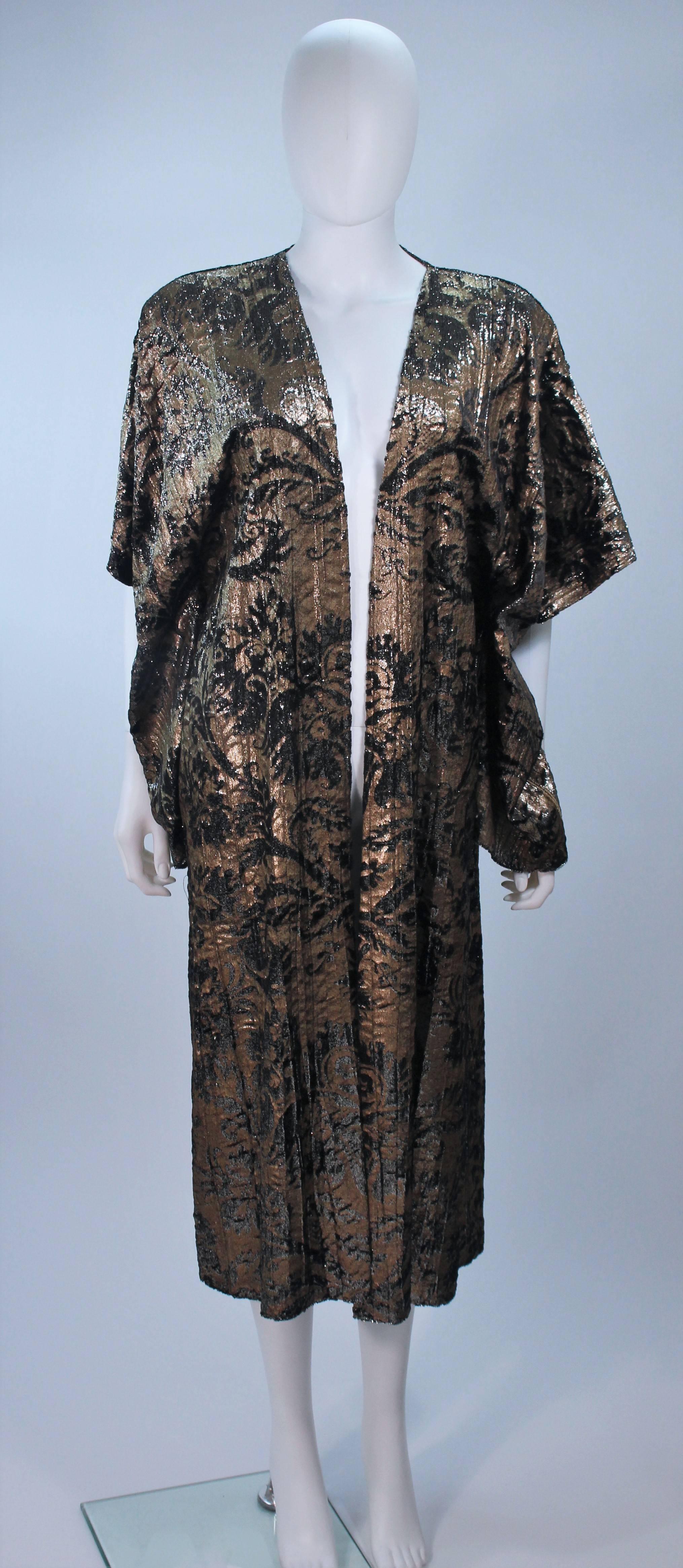  This Mali dcoat is composed of a painted metallic velvet silk. Features kimono sleeves with tassels and an open style. In great vintage condition. Made in Italy.

  **Please cross-reference measurements for personal accuracy. Size in description