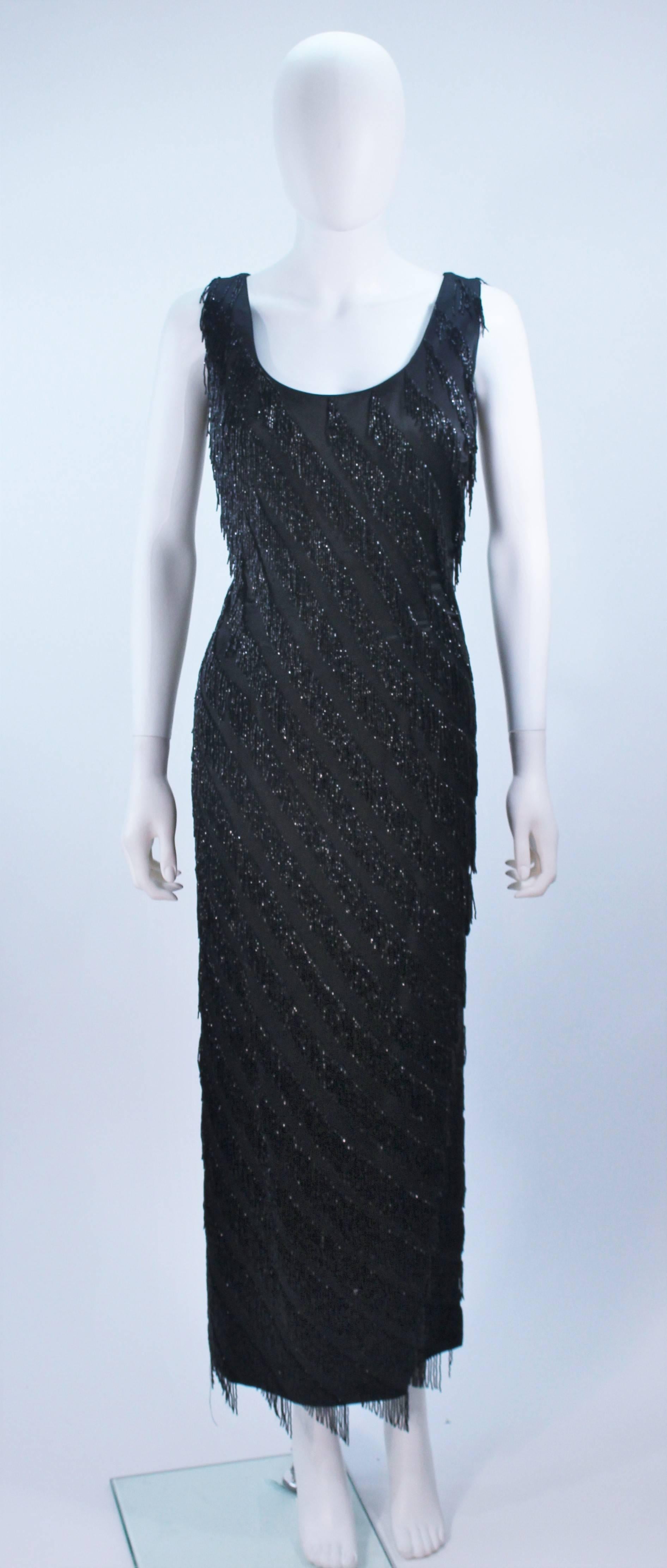  This Pauline Shen  gown is composed of a black silk with a beaded fringe detailing throughout. There is a center back zipper closure. In great vintage condition. 

  **Please cross-reference measurements for personal accuracy. Size in description