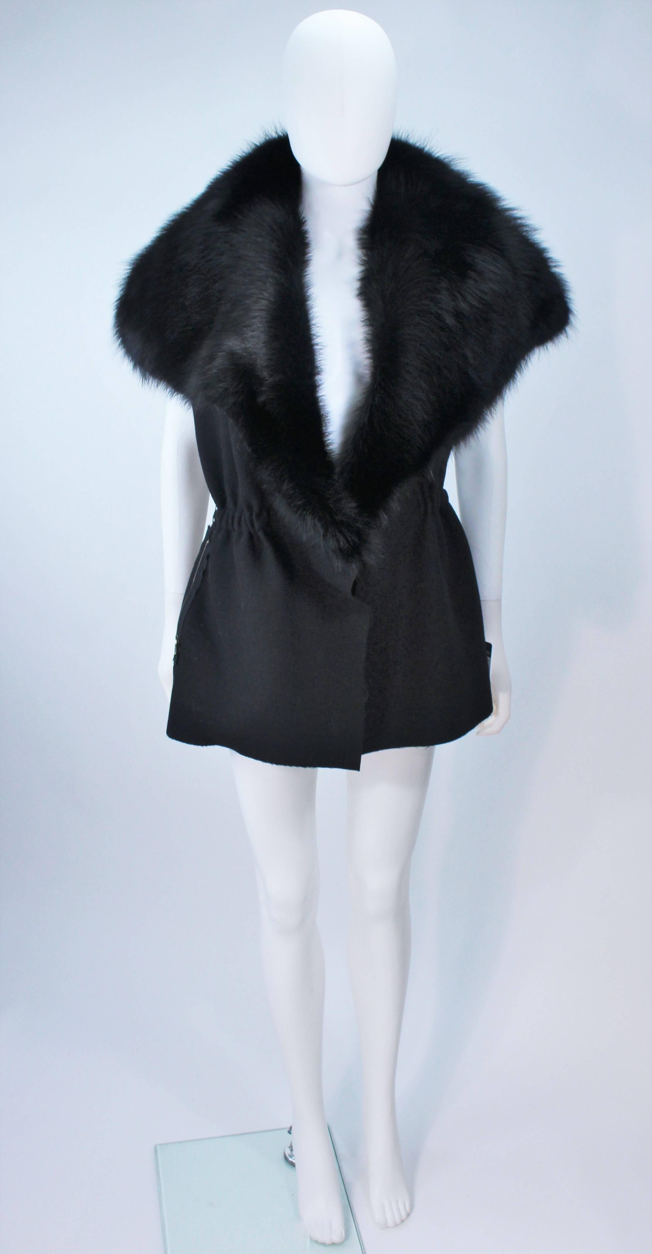 This Lanvin vest is composed of black wool with Luxurious Fisher fur trim. There are center front button closures and side zippers. In excellent unused condition with original tags. 

**Please cross-reference measurements for personal accuracy. 